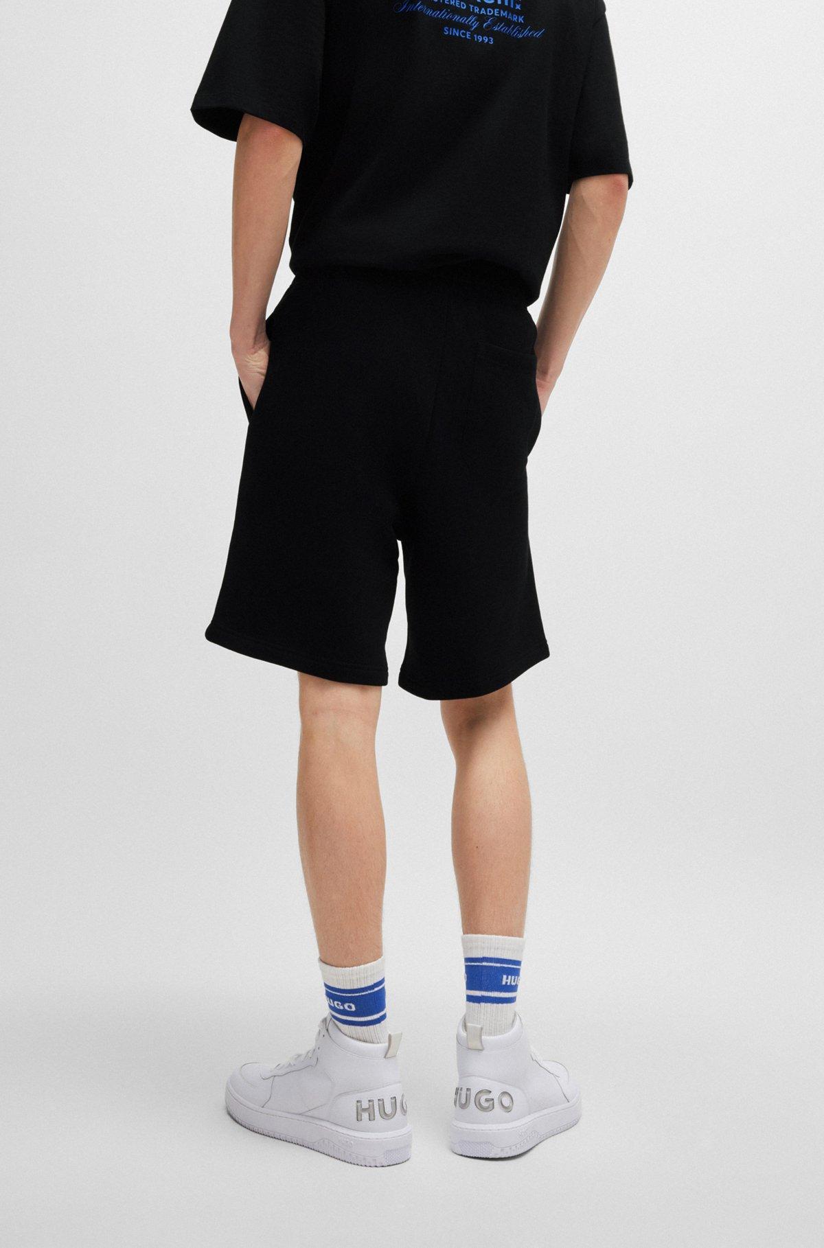 Loose-fit shorts in cotton terry with logo print Product Image