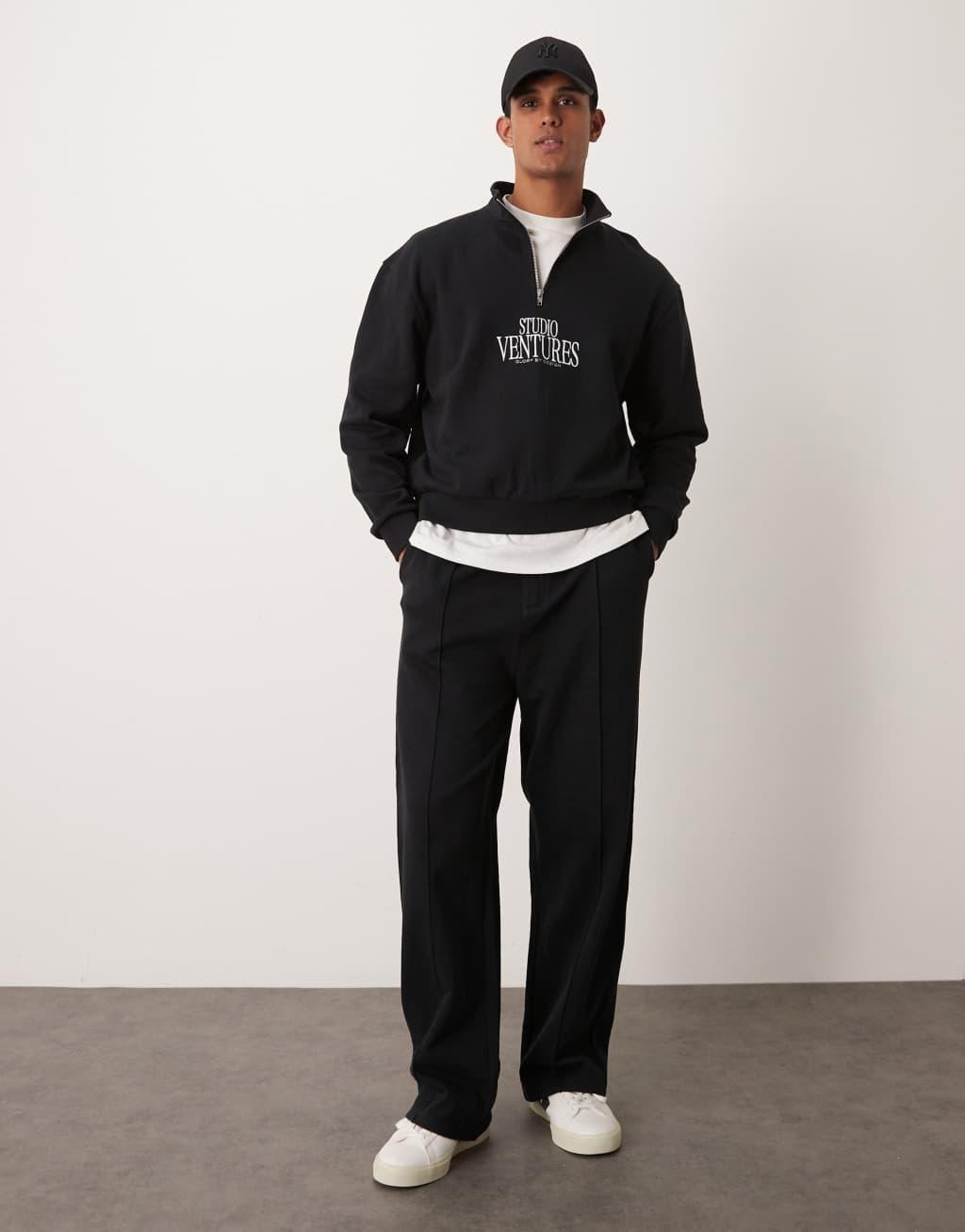 ASOS DESIGN wide leg sweatpants with pin tucks and zip fastening in black Product Image