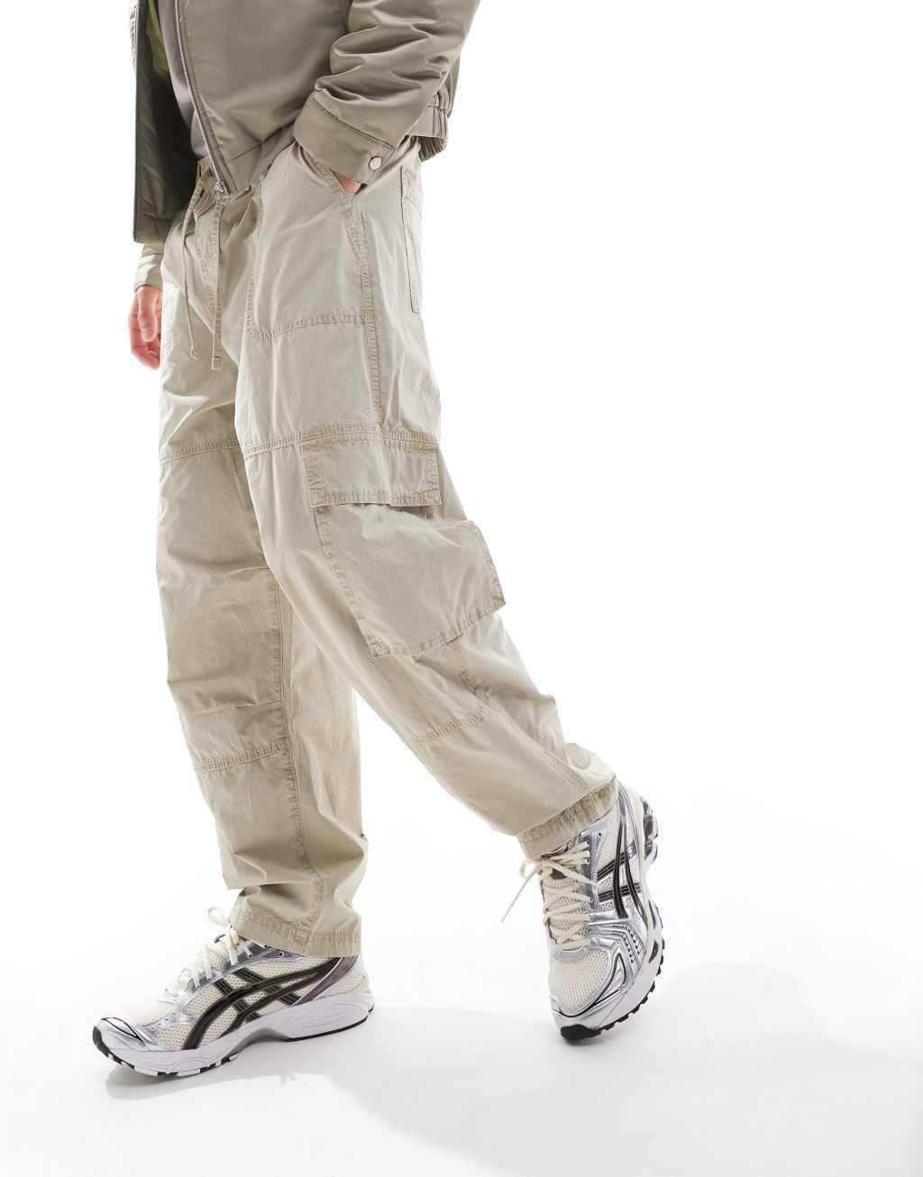 ASOS DESIGN washed baggy cargo pants with panel detailing in stone Product Image