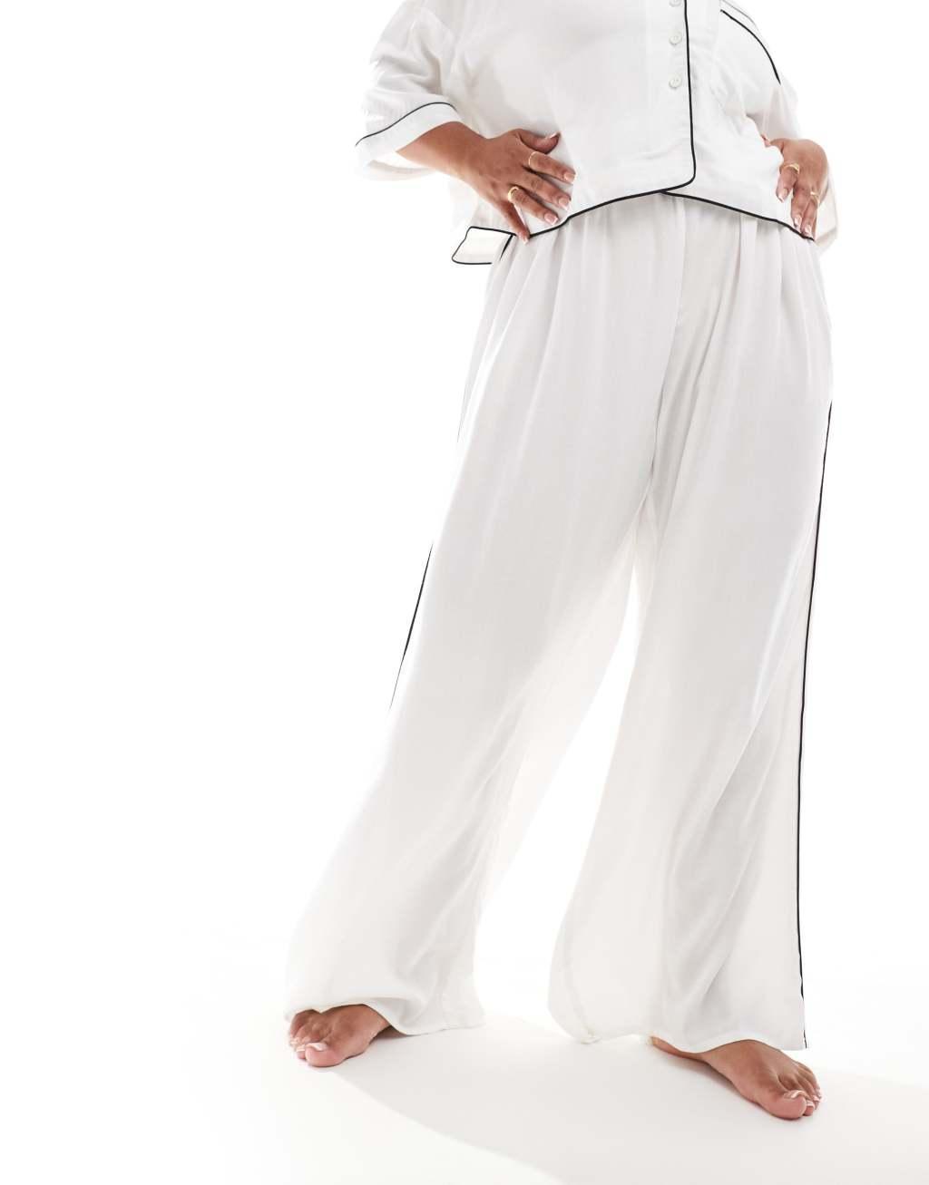 ASOS DESIGN Curve super soft slinky wide leg pajama pants in white with contrast binding Product Image