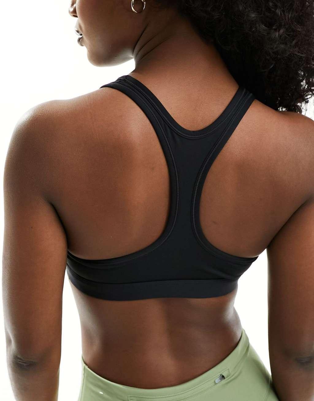 Nike Training Swoosh light support sports bra in black Product Image