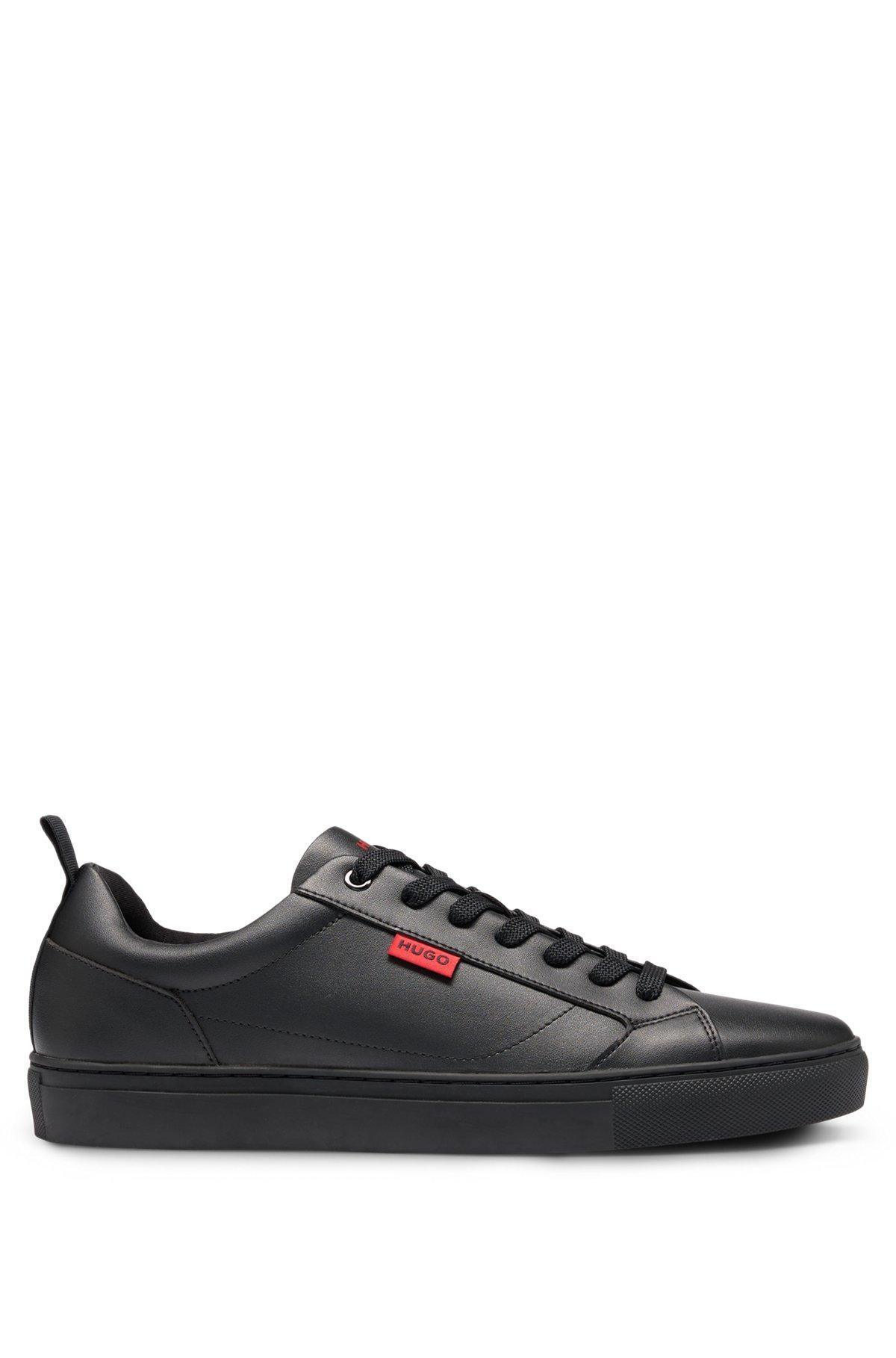 Faux-leather trainers with red logo flag Product Image