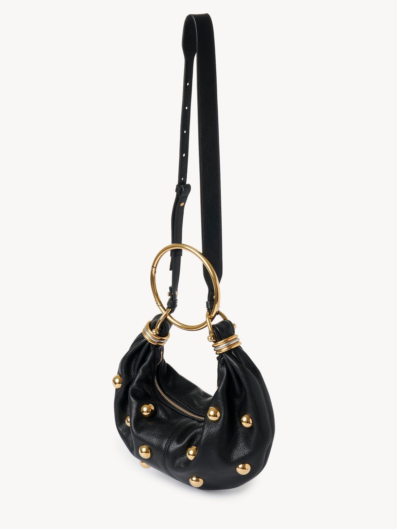 Small Bracelet hobo bag in grained leather with studs Product Image