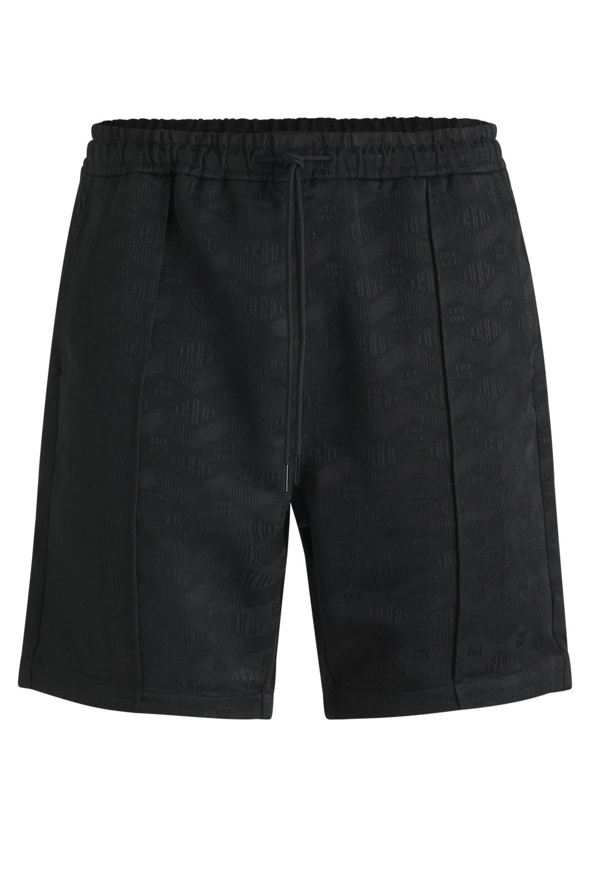 Relaxed-fit shorts with geometric logos Product Image
