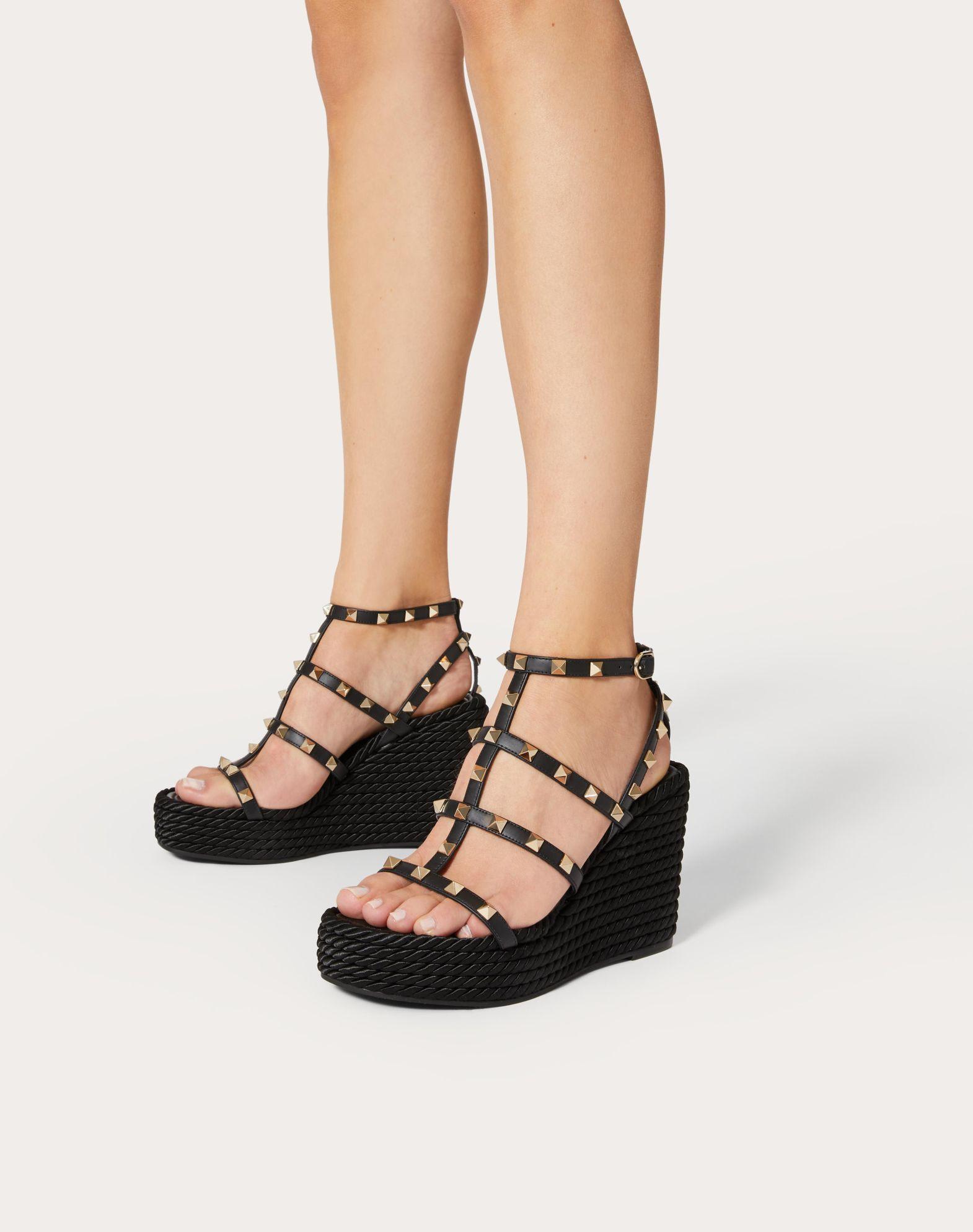ROCKSTUD ANKLE STRAP WEDGE SANDAL IN CALFSKIN LEATHER 95 MM Product Image