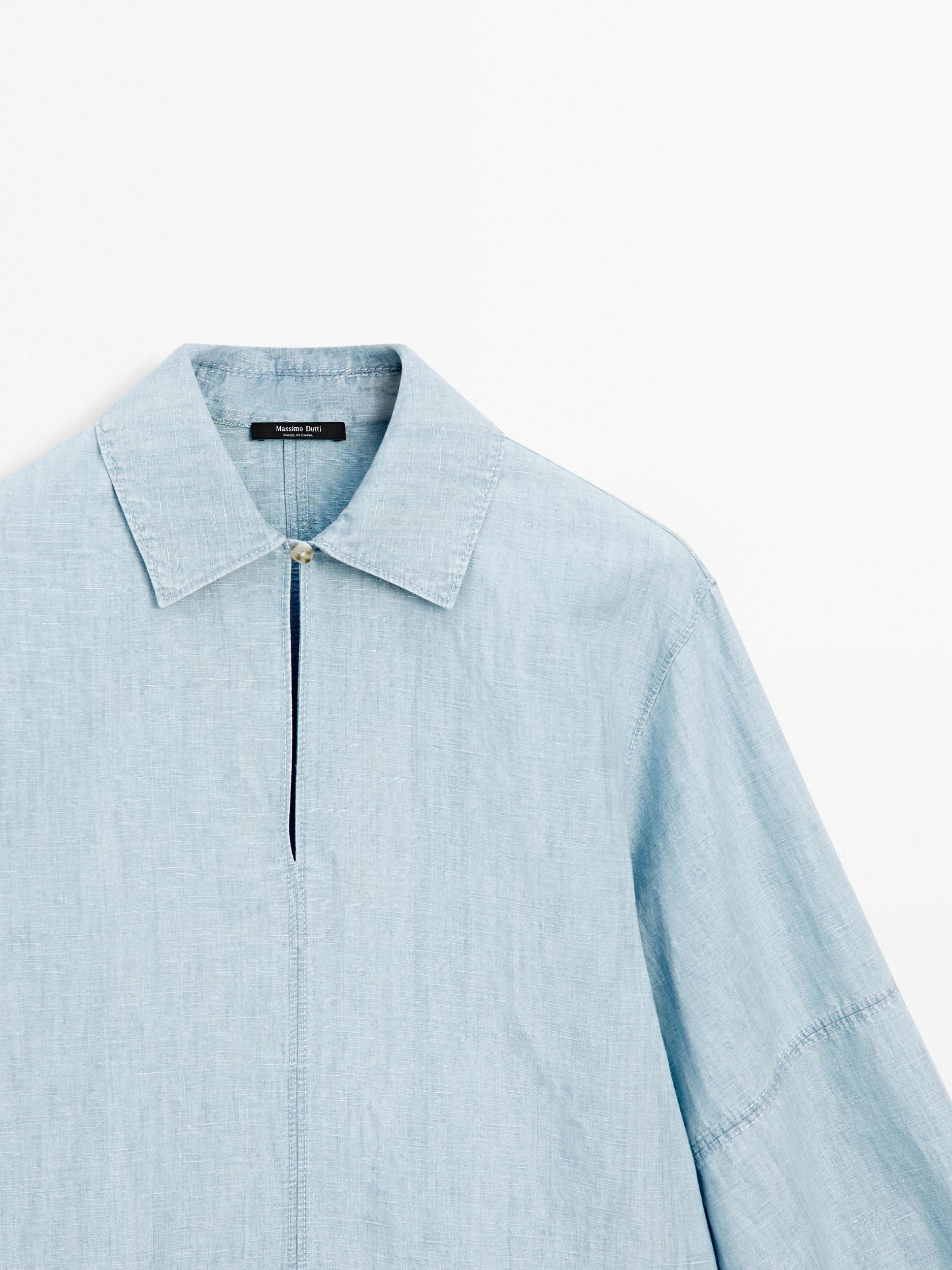 Oversize denim blouse with puff sleeves Product Image