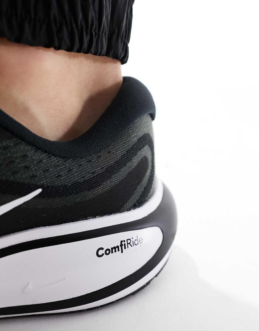 Nike Running Journey Run sneakers in black and white Product Image
