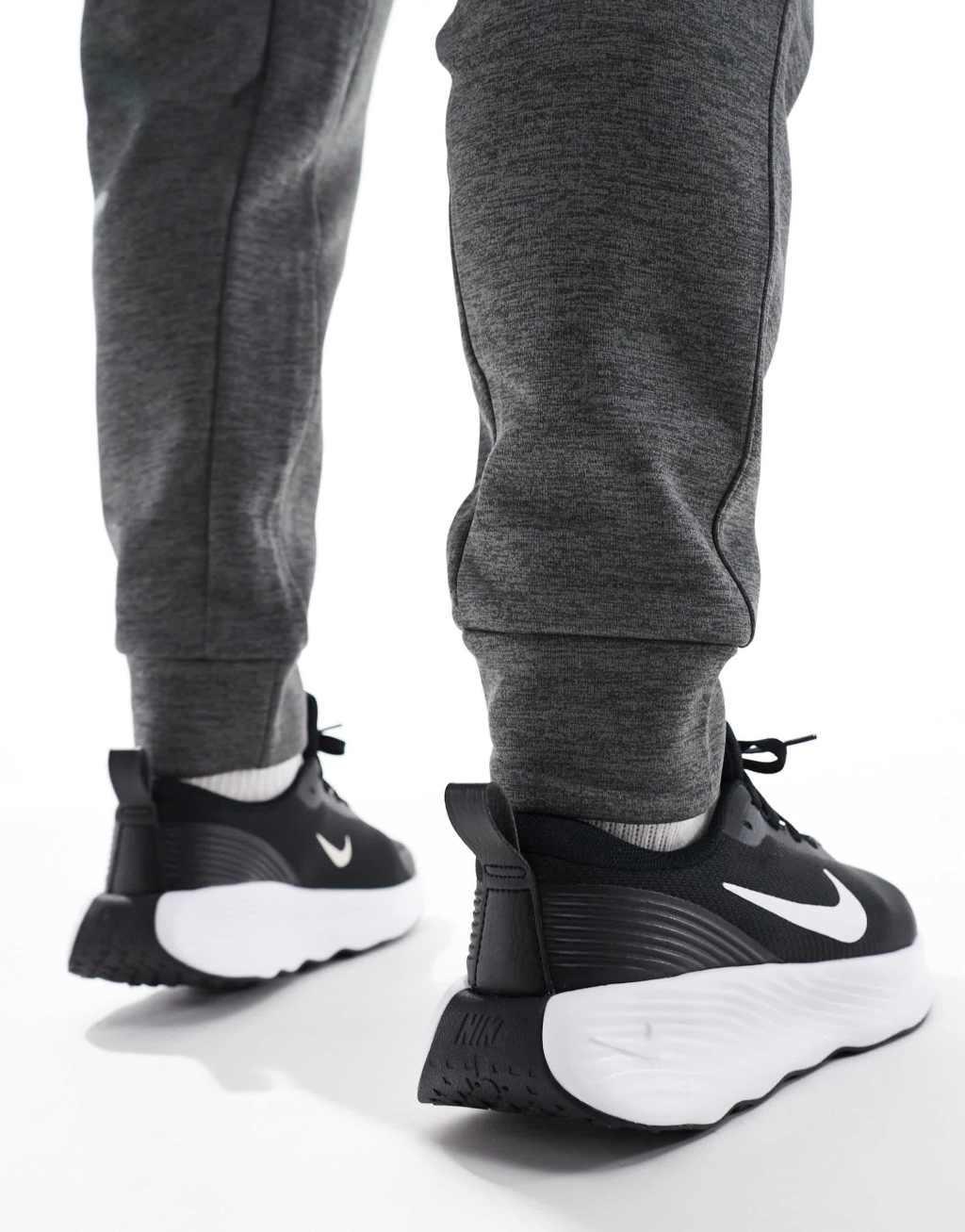 Nike Training Legend Essential 4 sneakers in black and white Product Image