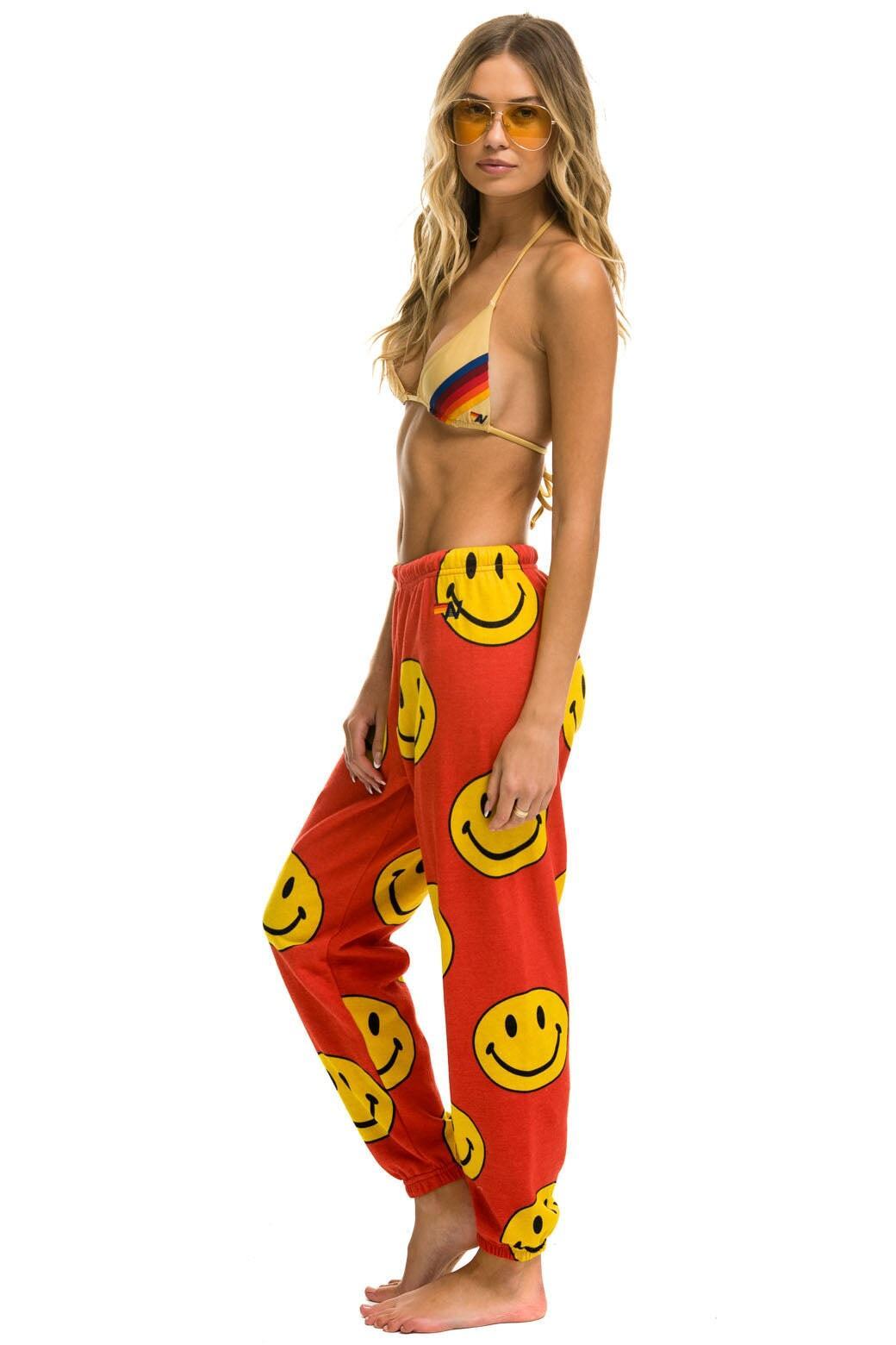 SMILEY REPEAT SWEATPANTS - RED Female Product Image