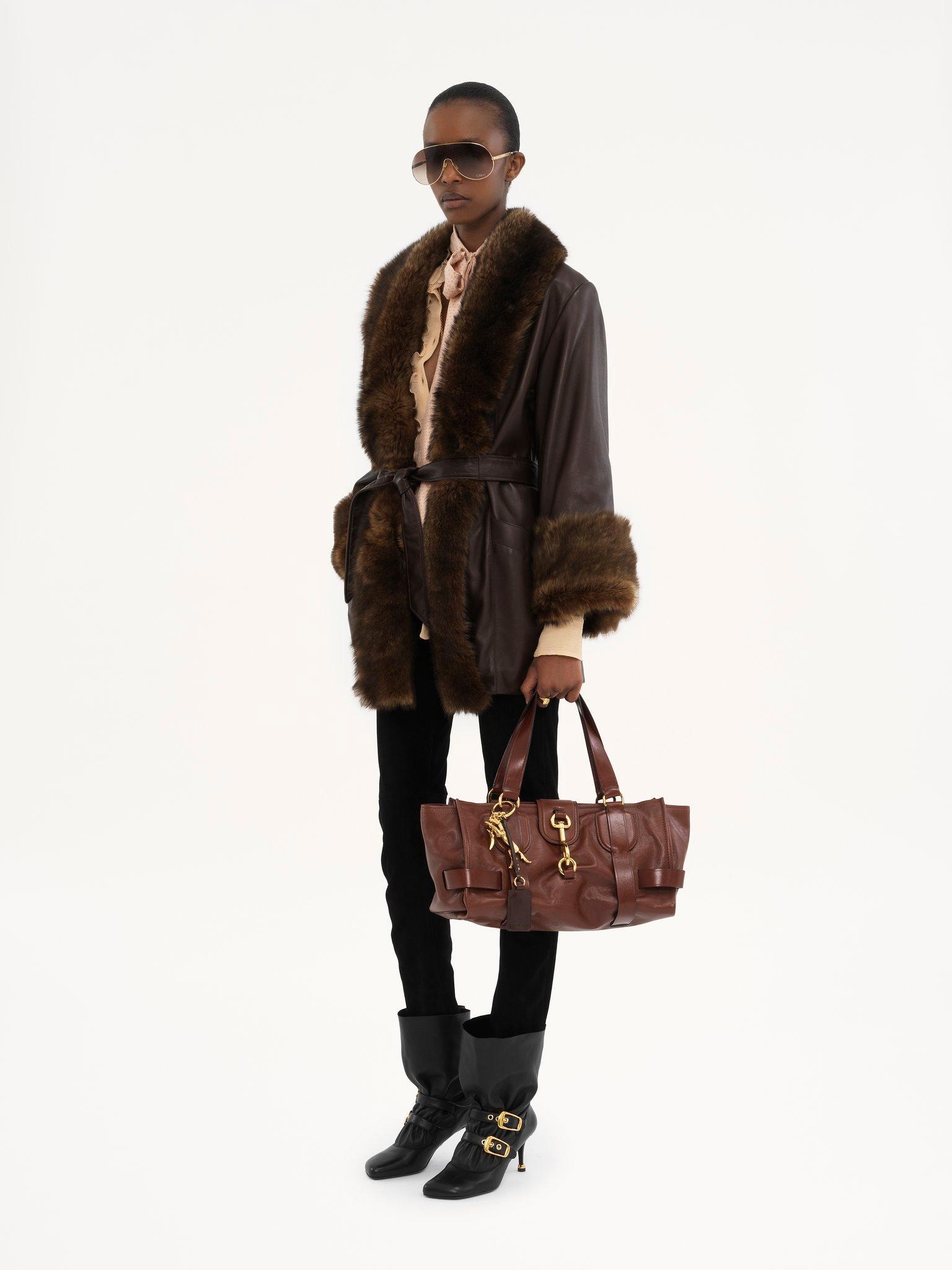 Belted oversized coat in leather Product Image