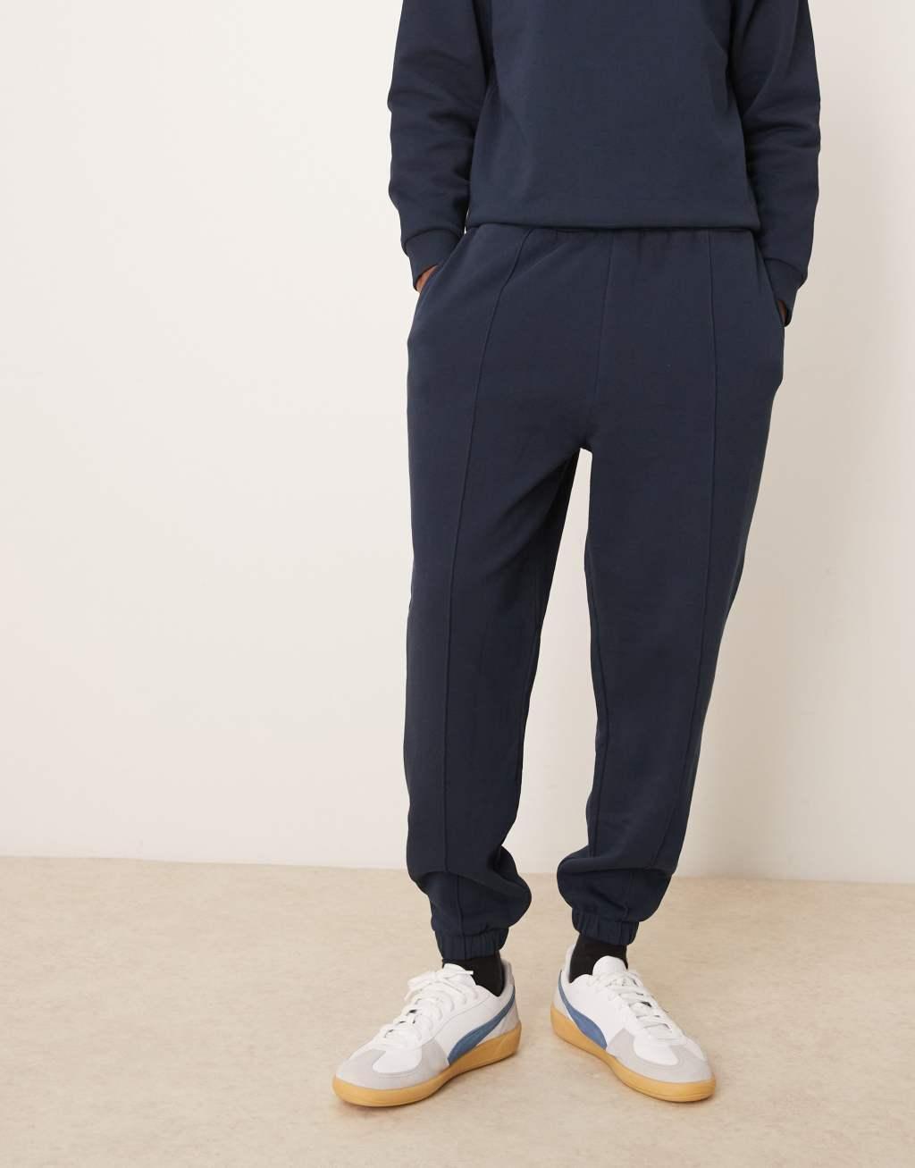 ASOS DESIGN tapered pin tuck sweatpants in navy - part of a set Product Image