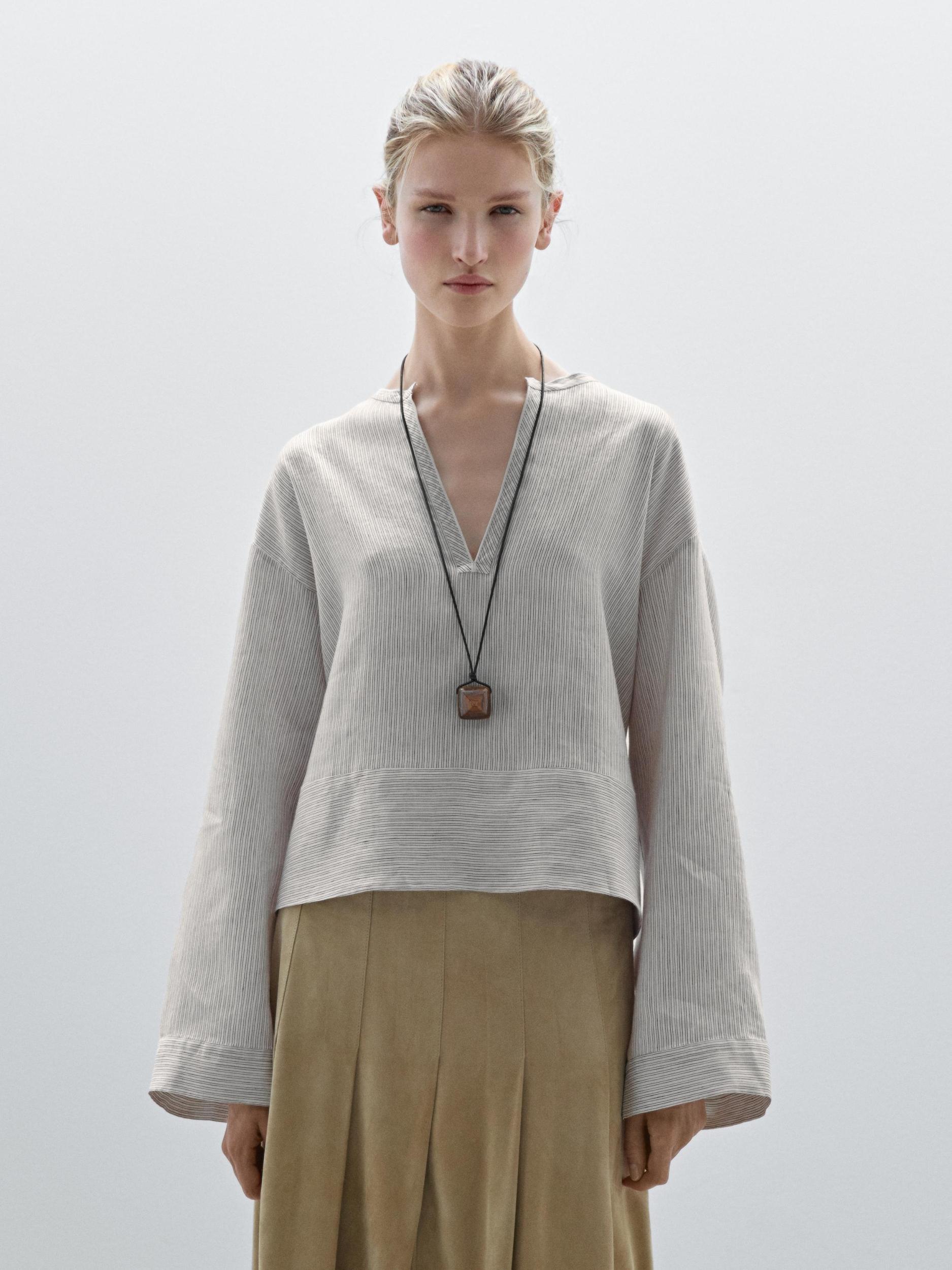 Striped satin shirt with wide hem Product Image