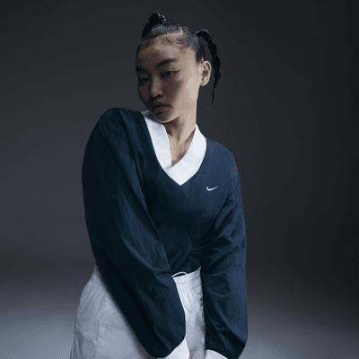 Nike Sportswear Essential Women's Loose UV Woven Long-Sleeve V-Neck Top Product Image