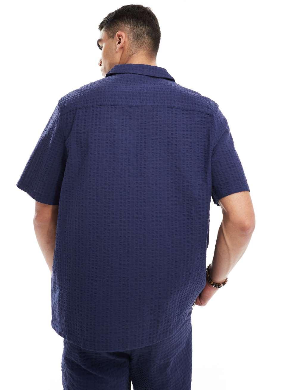 ASOS DESIGN 90s oversized short sleeve shirt in seersucker texture in navy - part of a set Product Image