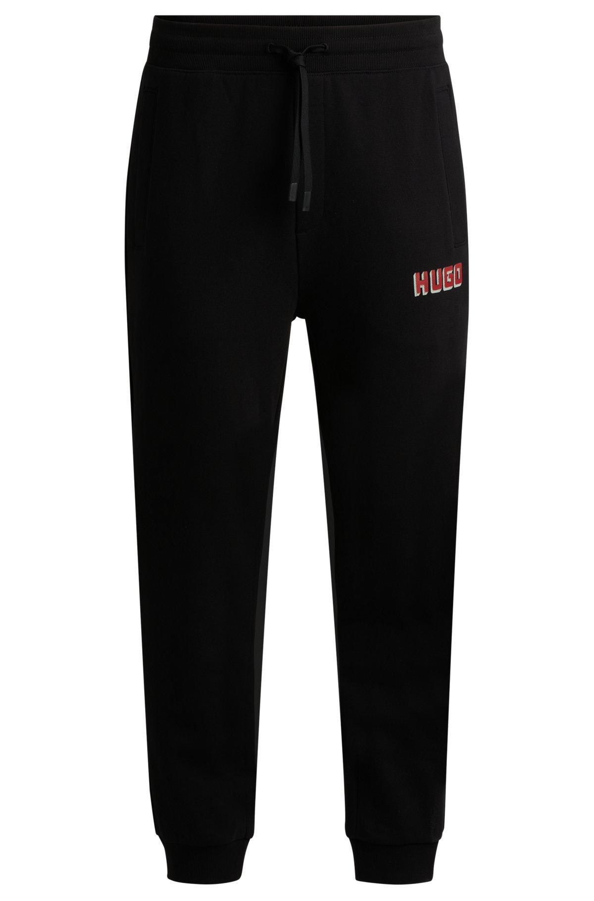 Cotton-terry tracksuit bottoms with logo print Product Image
