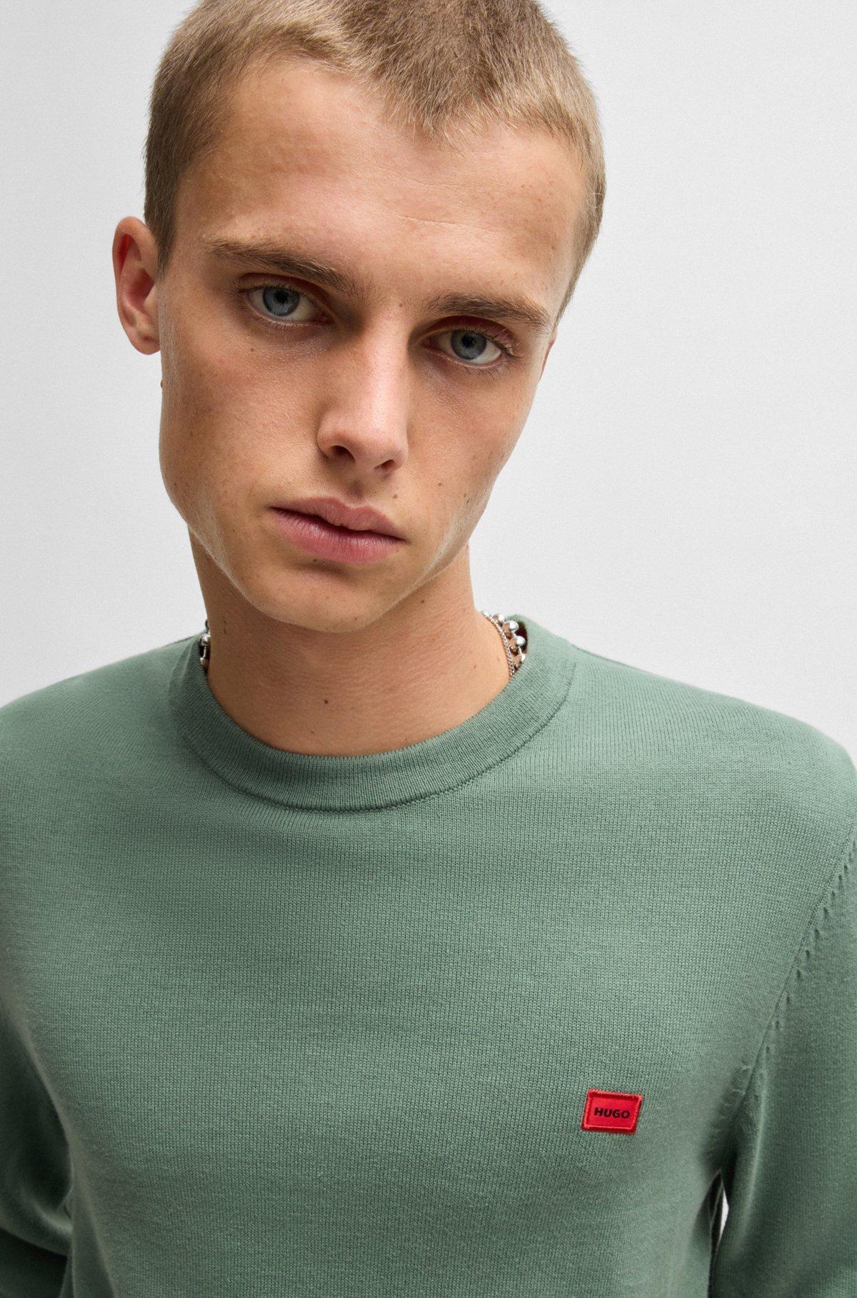 Cotton sweater with red logo label Product Image