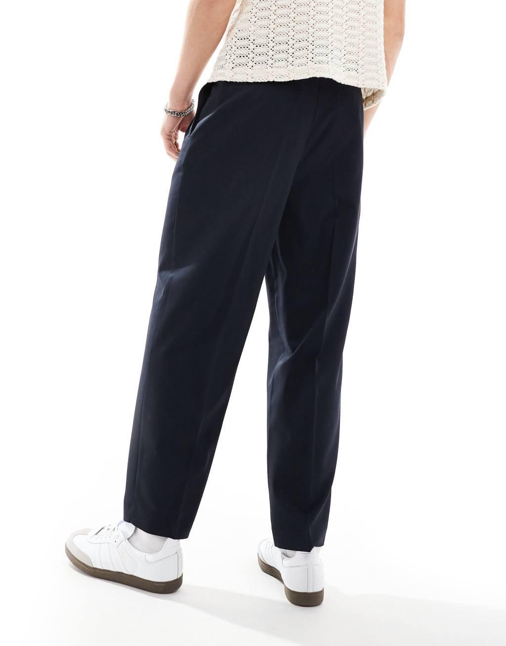 ASOS DESIGN oversized tapered dress pants with double pleat in navy Product Image