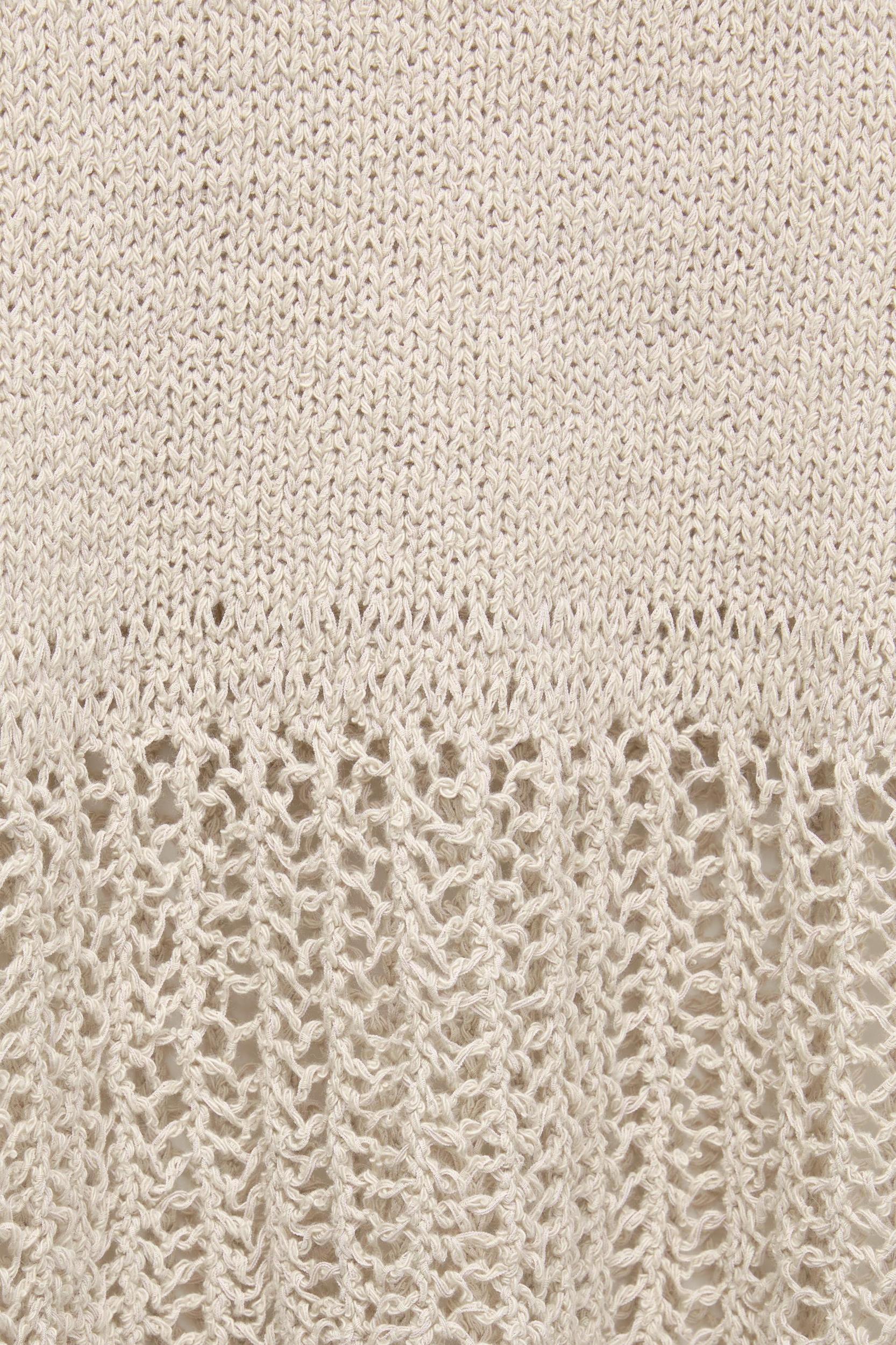 Knit top with an open knit hem Product Image