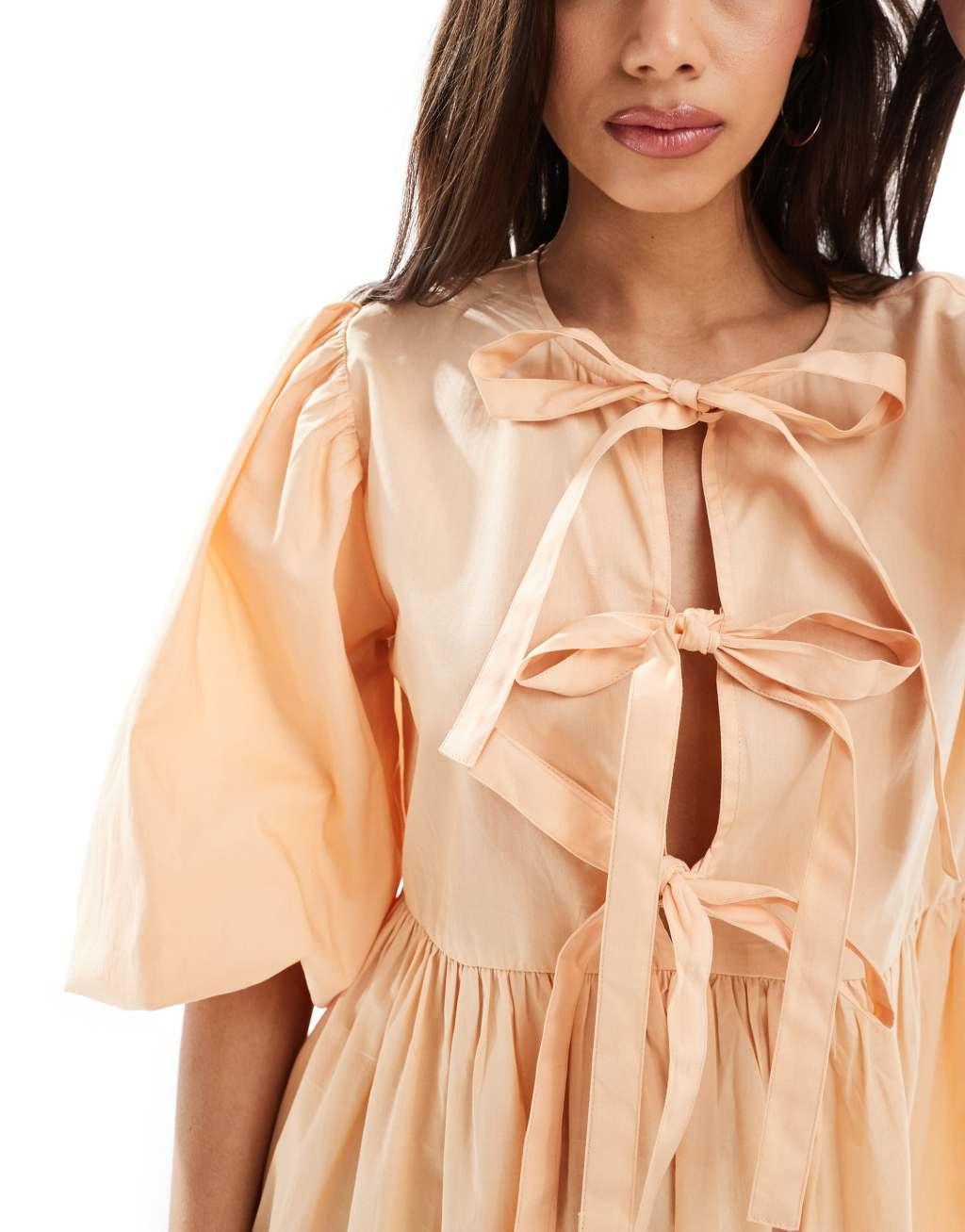 ASOS DESIGN bow tie front mini smock dress in peach fuzz  Product Image