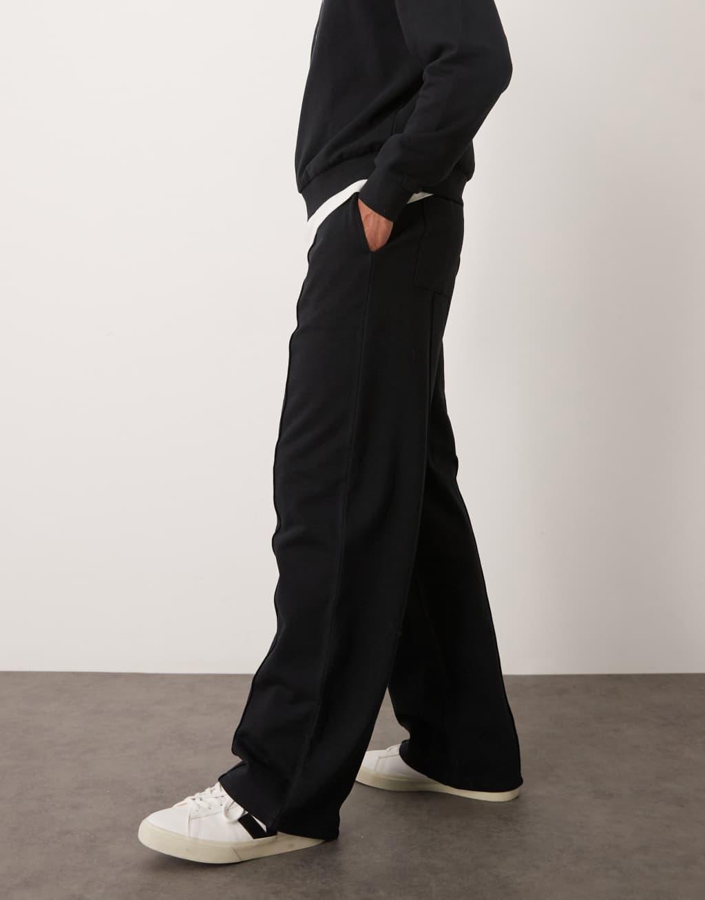 ASOS DESIGN wide leg sweatpants with pin tucks and zip fastening in black Product Image