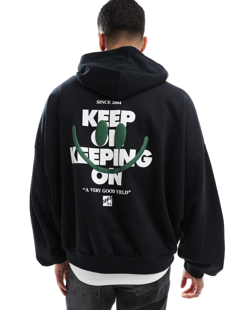 ASOS DESIGN oversized hoodie with back print in black Product Image