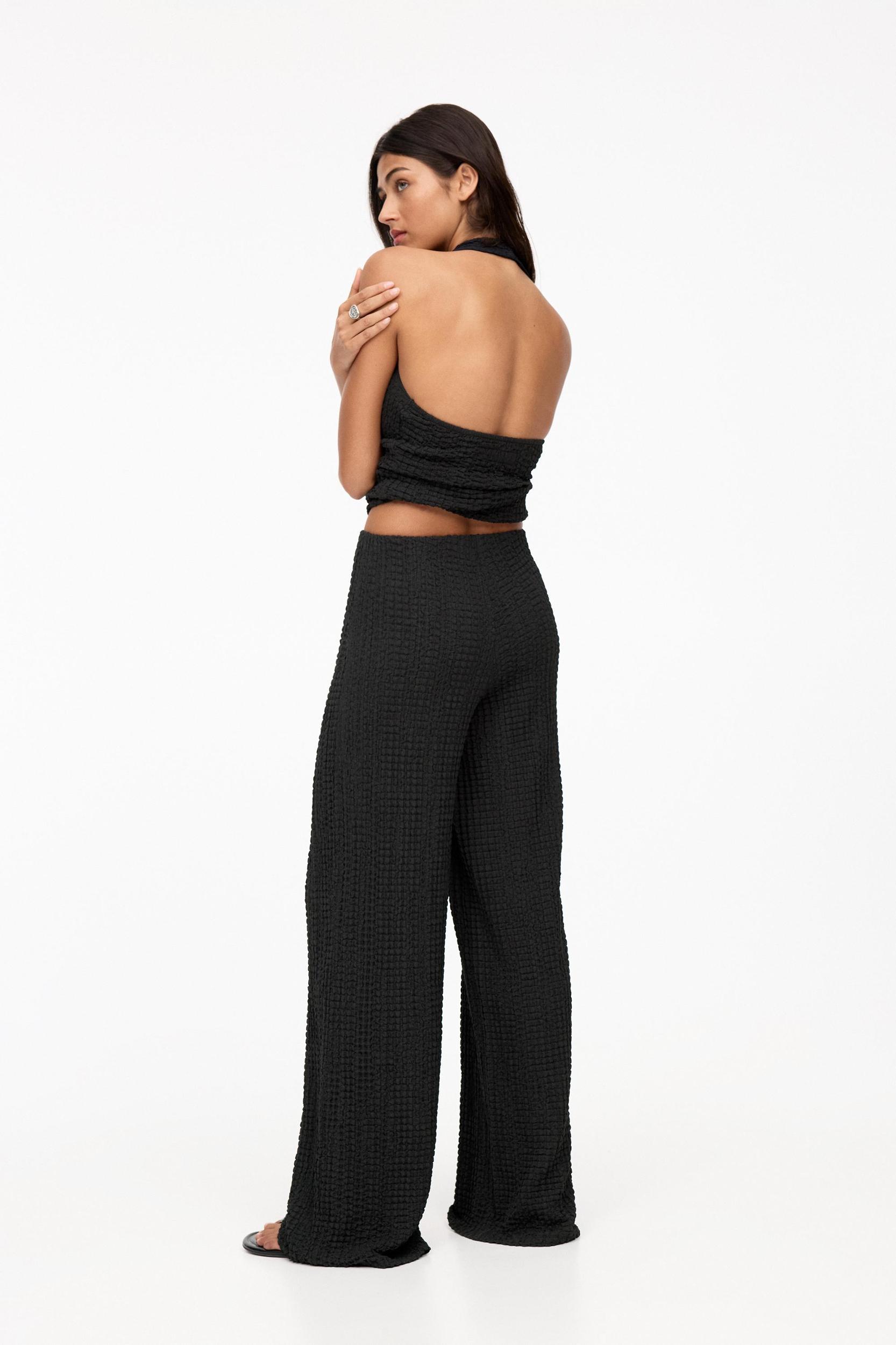 Rustic creased-effect pants Product Image