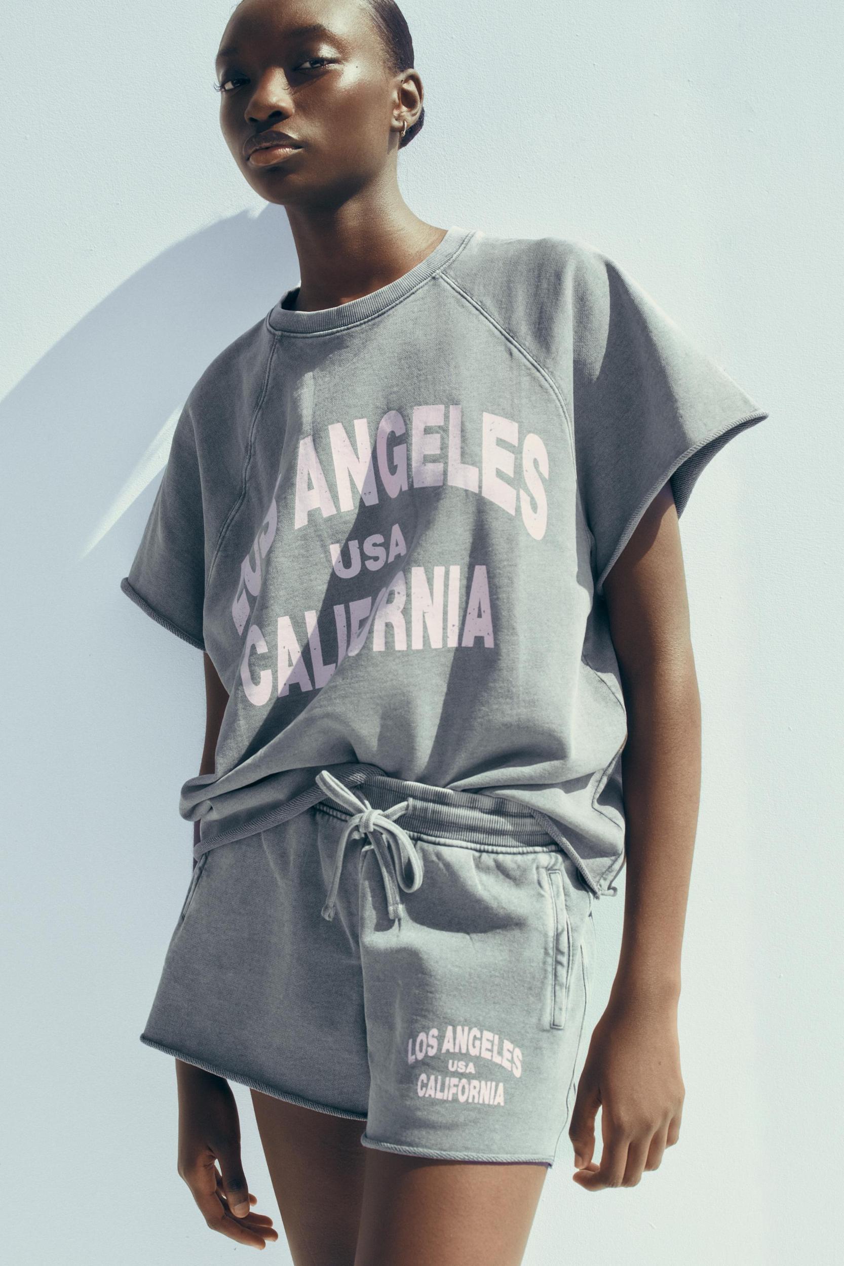 WASHED EFFECT TEXT SWEATSHORTS Product Image