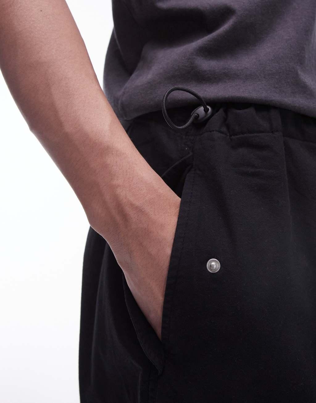 Topman wide cargo pants in black Product Image