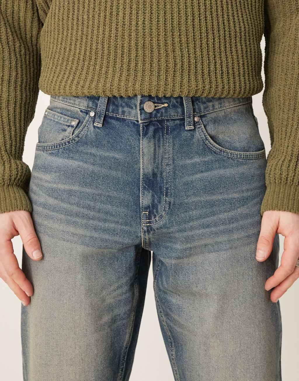 ASOS DESIGN tapered jeans in mid wash Product Image