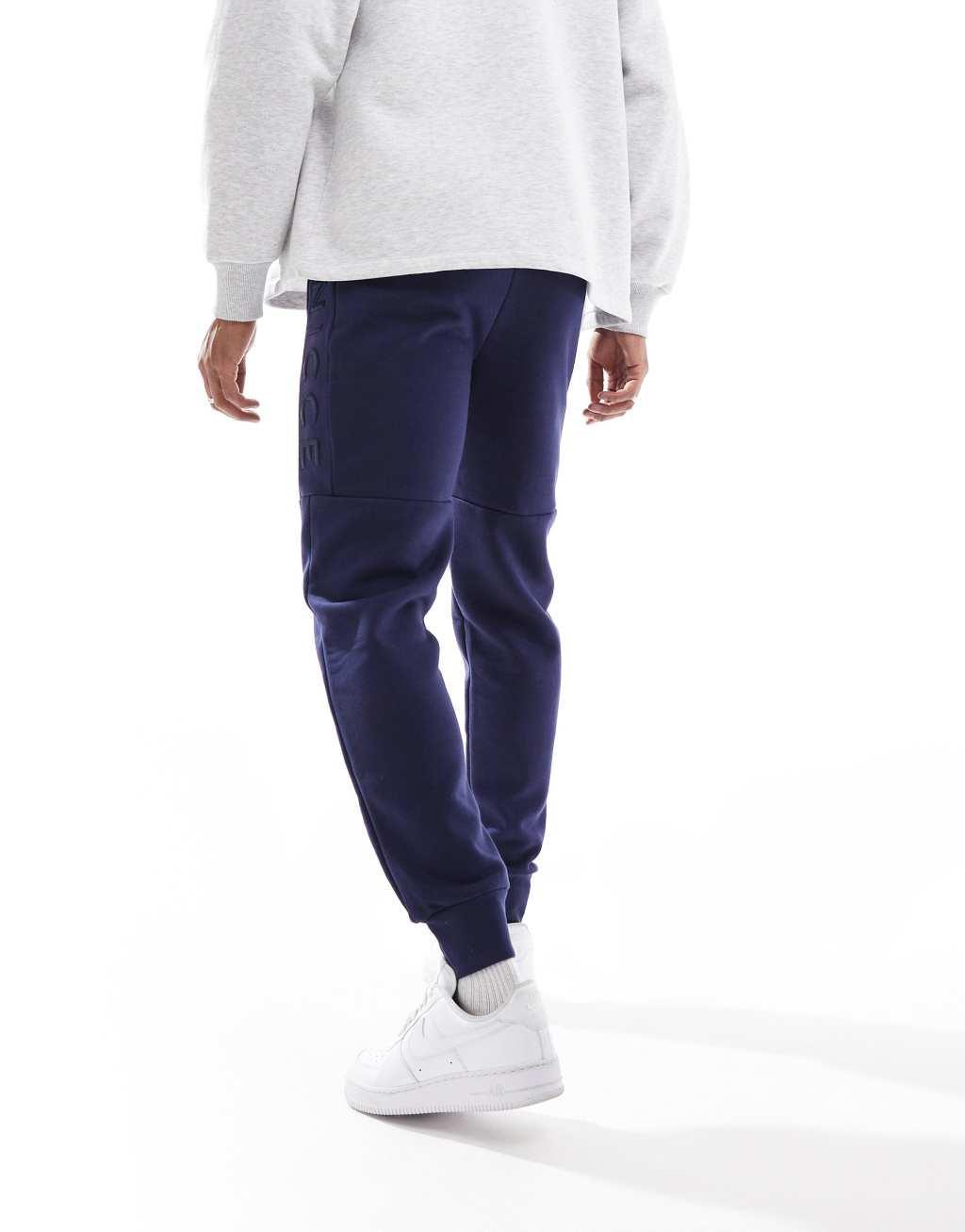 Nicce logo sweatpants in navy Product Image