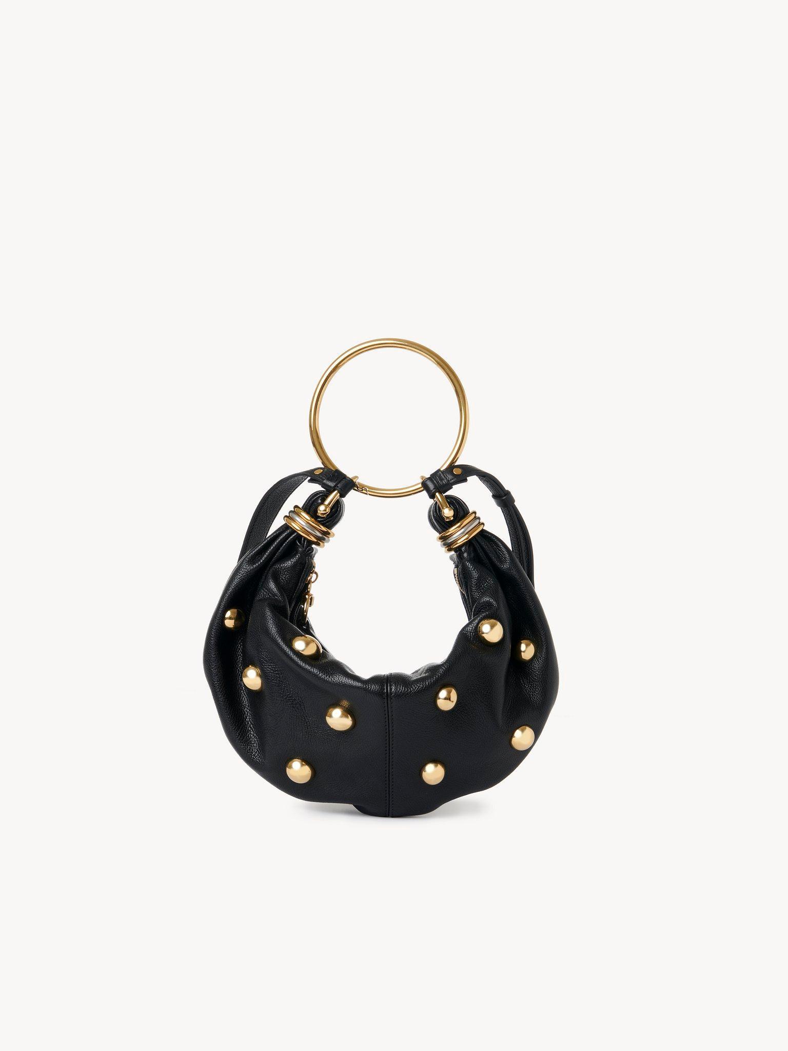 Small Bracelet hobo bag in grained leather with studs Product Image