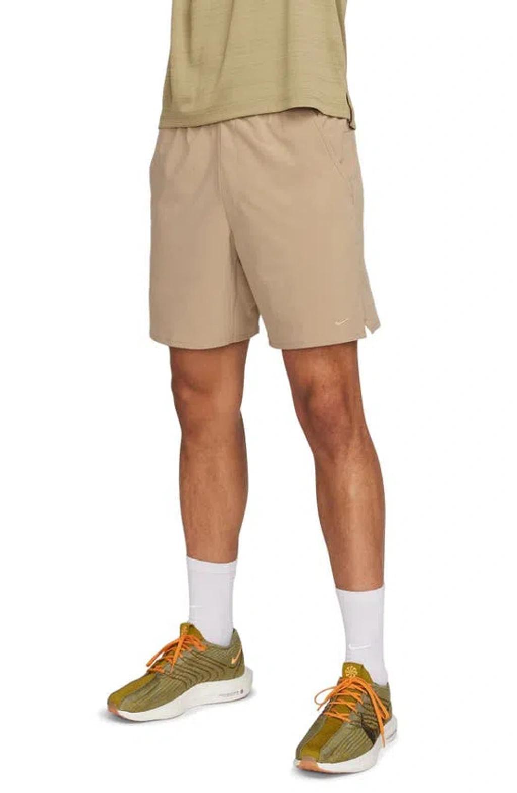 NIKE Training Dri-fit Unlimited Woven 7inch Shorts In Beige-green In Brown Product Image