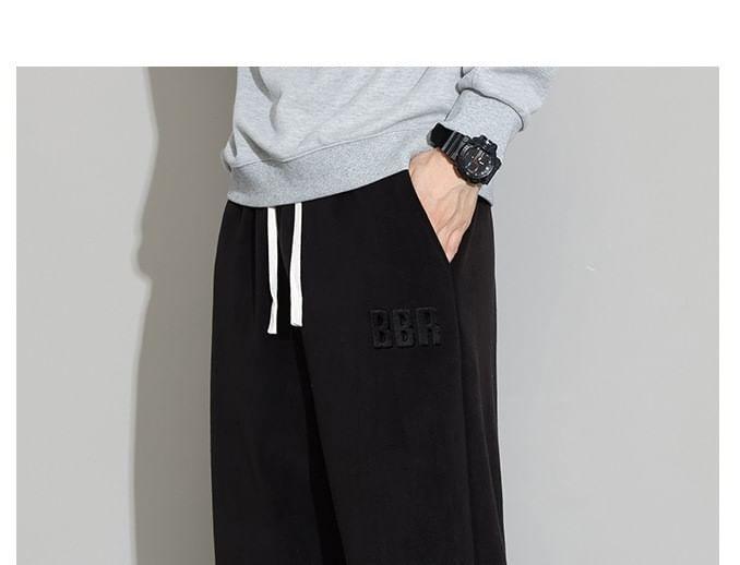 Drawstring Waist Lettering Embossed Fleece Loose Fit Sweatpants Product Image