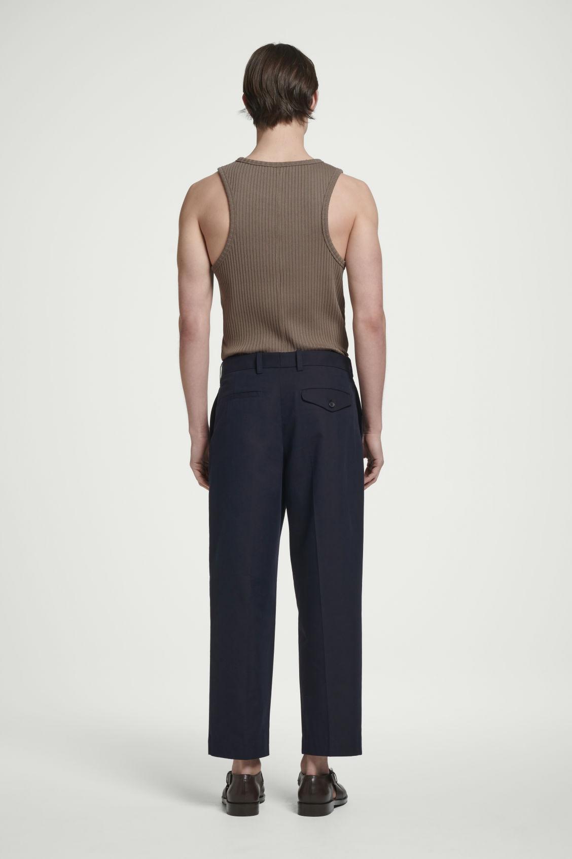 RELAXED PLEATED COTTON TAPERED PANTS Product Image