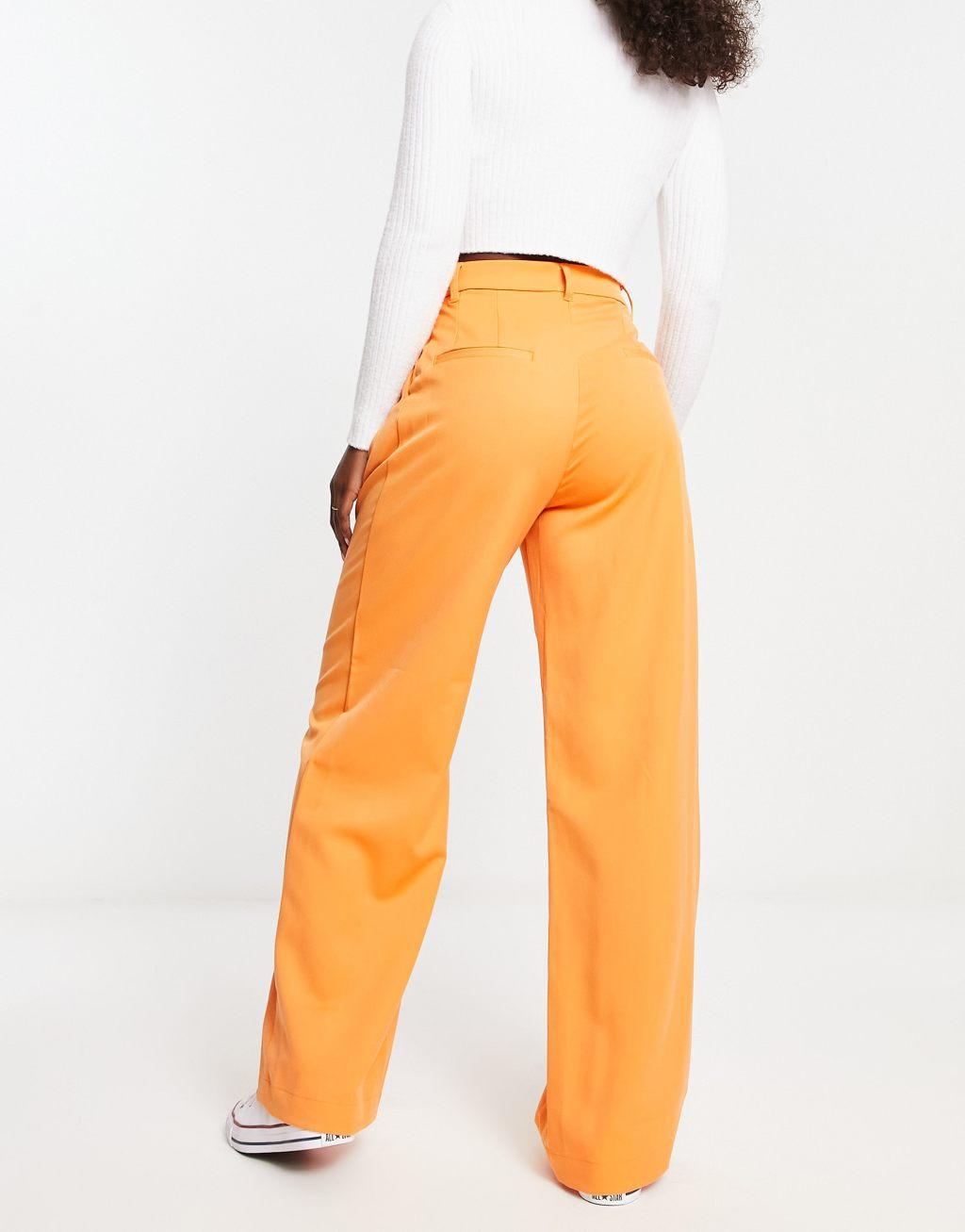 Monki high waist pleat front pants in orange Product Image