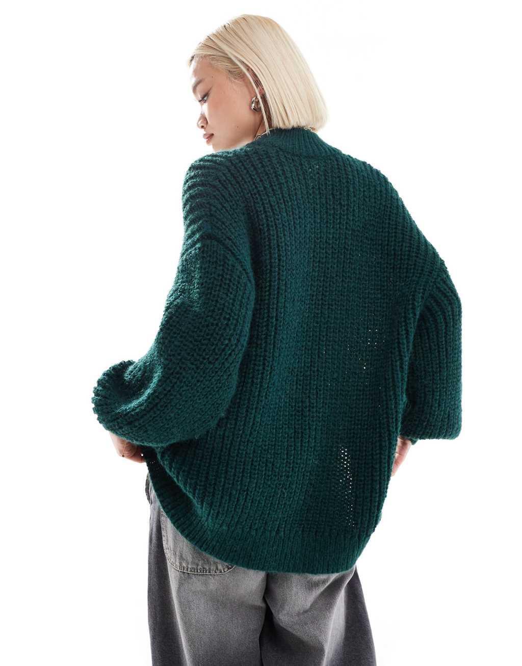 Monki high neck chunky rib knitted sweater with volume sleeve in dark green Product Image