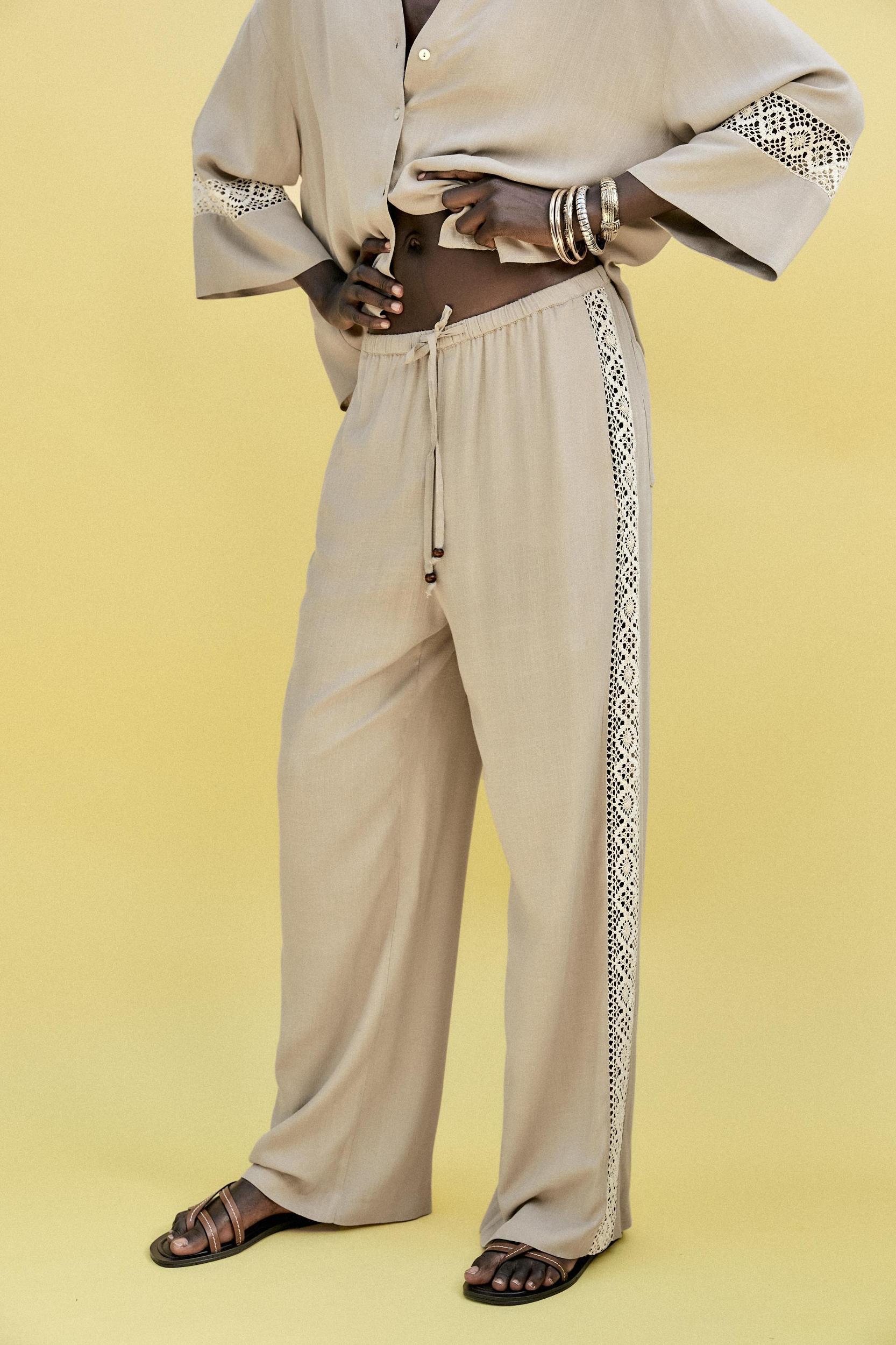 WIDE LEG PANTS WITH EMBROIDERED SIDE STRIPES Product Image