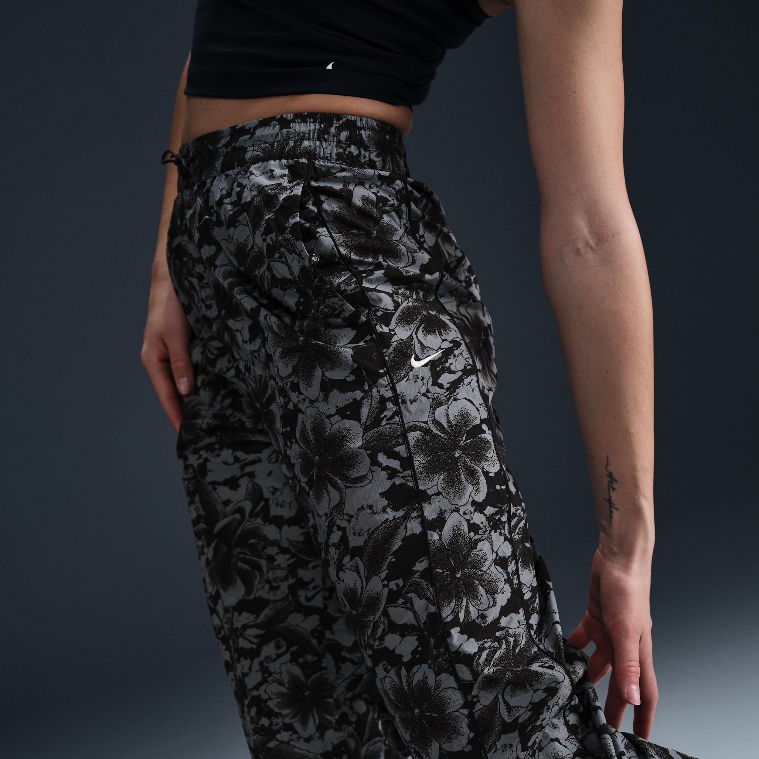 Nike Sportswear Windrunner Women's UV Protection Mid-Rise Woven Printed Pants Product Image