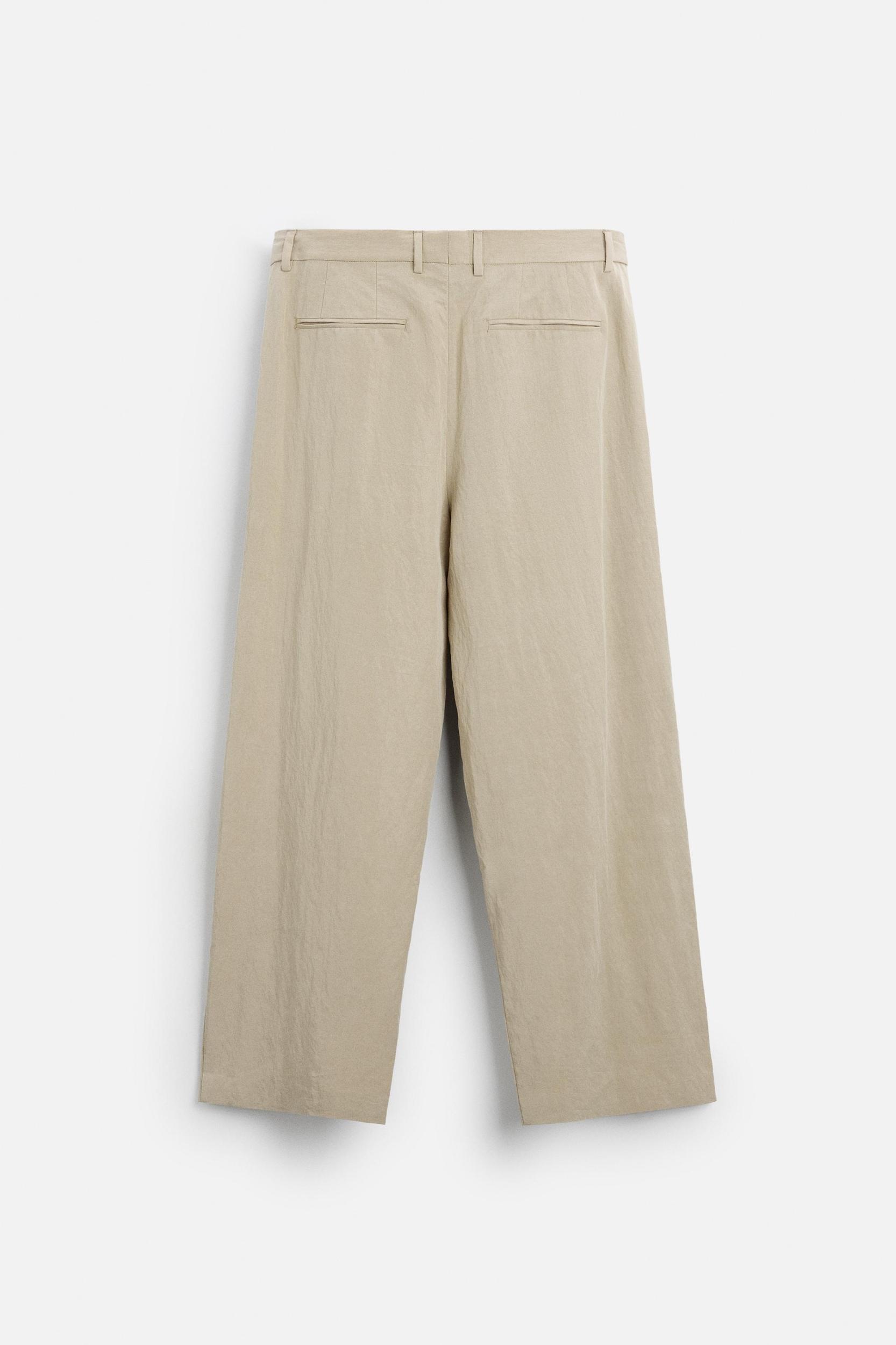 PLEATED WIDE FIT PANTS Product Image