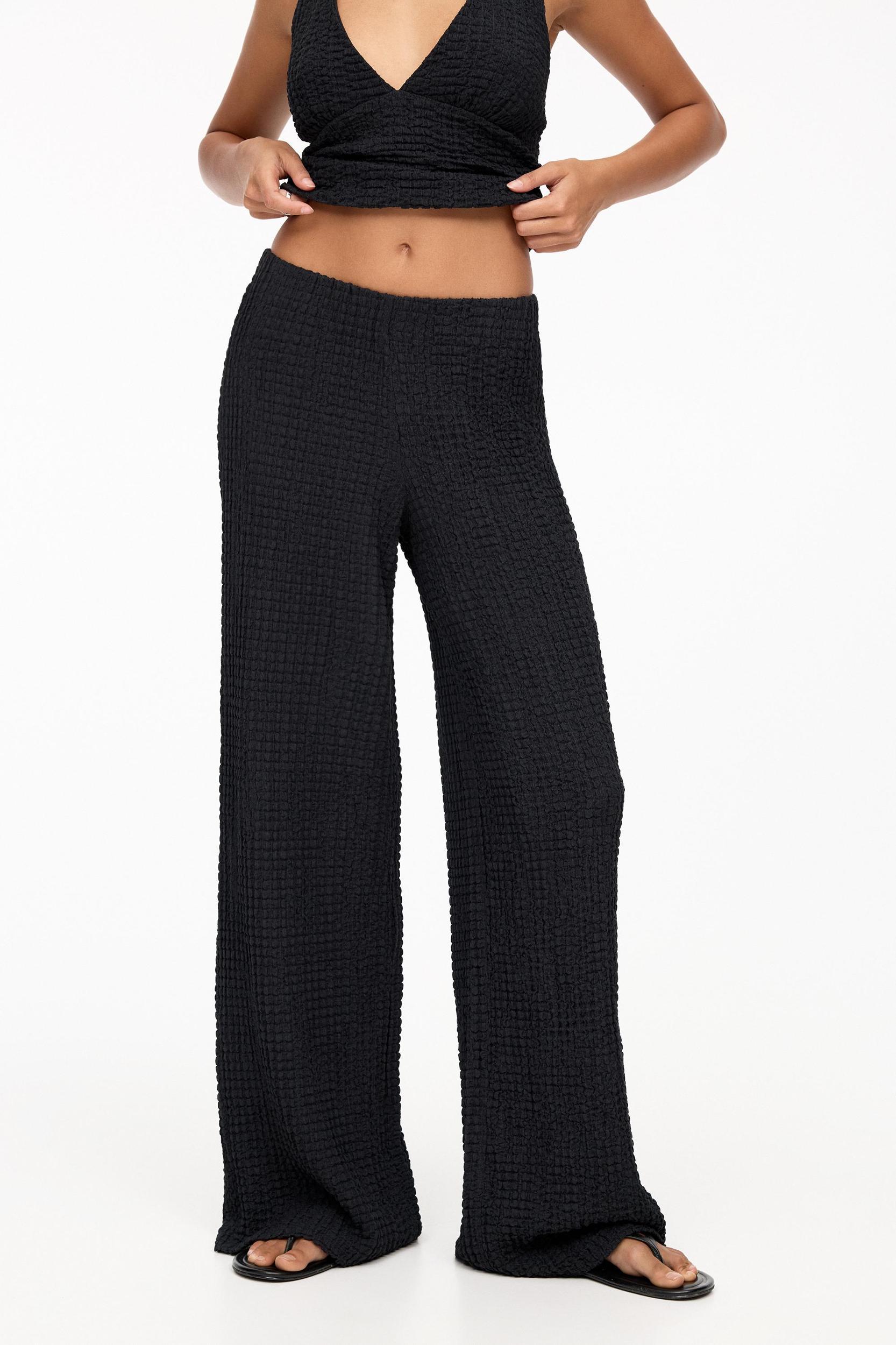 Rustic creased-effect pants Product Image