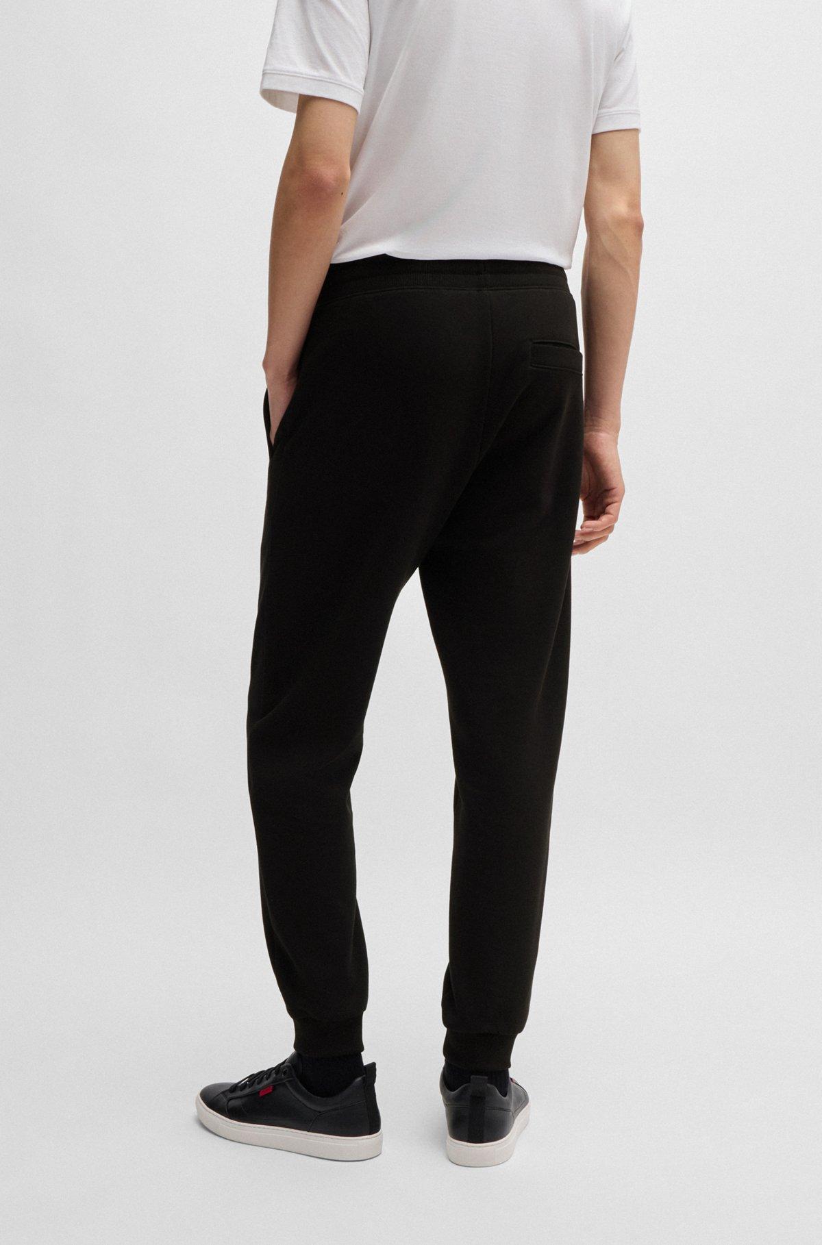 Cotton-terry tracksuit bottoms with logo print Product Image