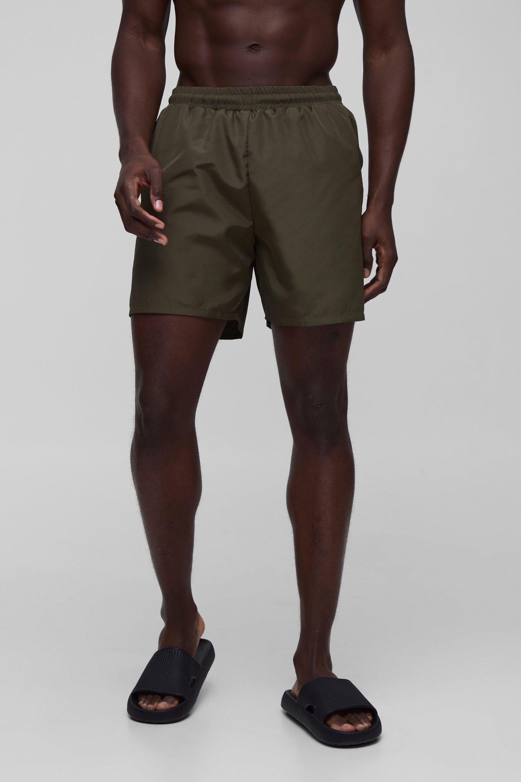 Regular fit Mid length Plain Swim Shorts | boohooMAN USA Product Image