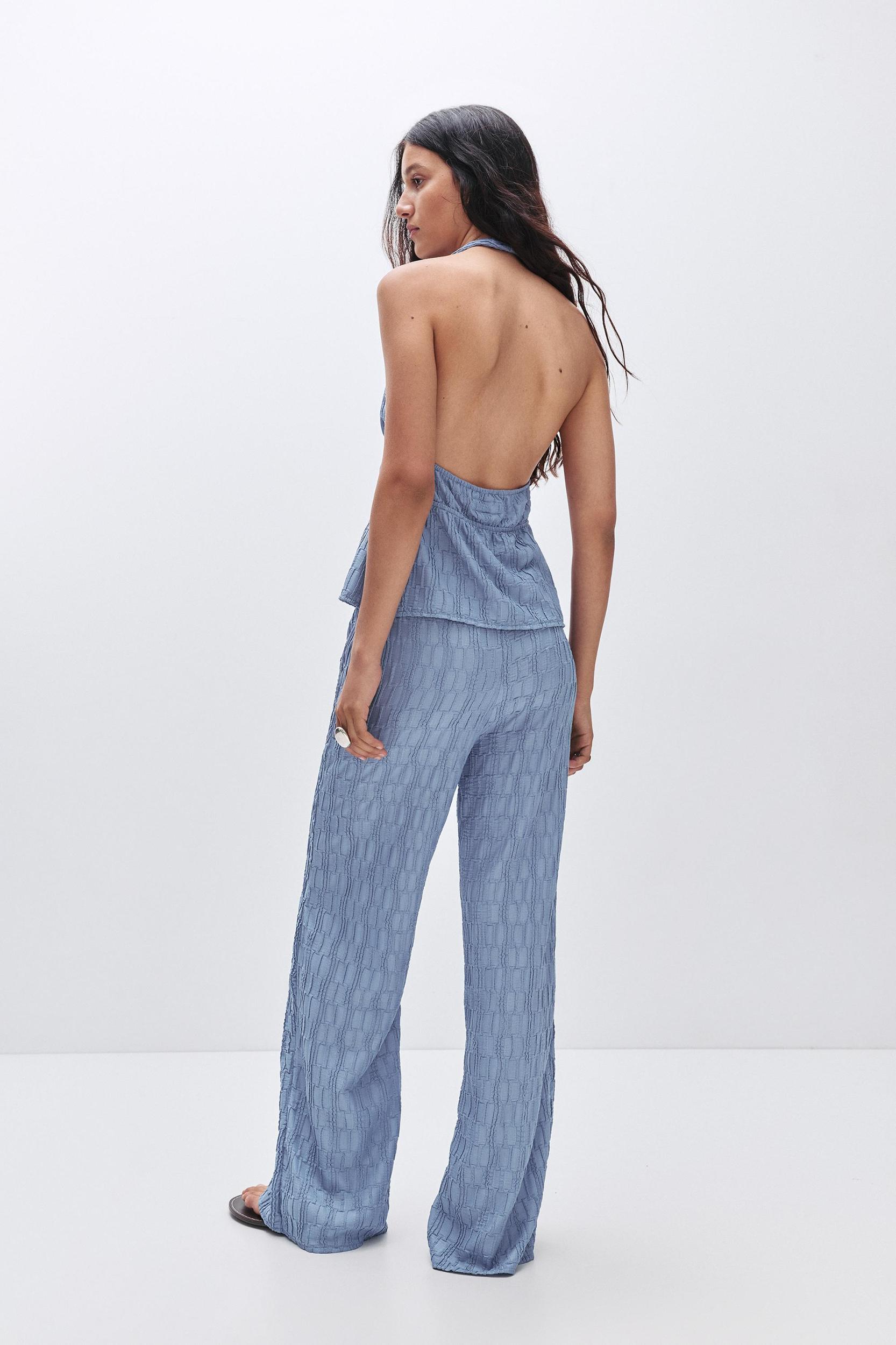 Textured bell bottom trousers Product Image