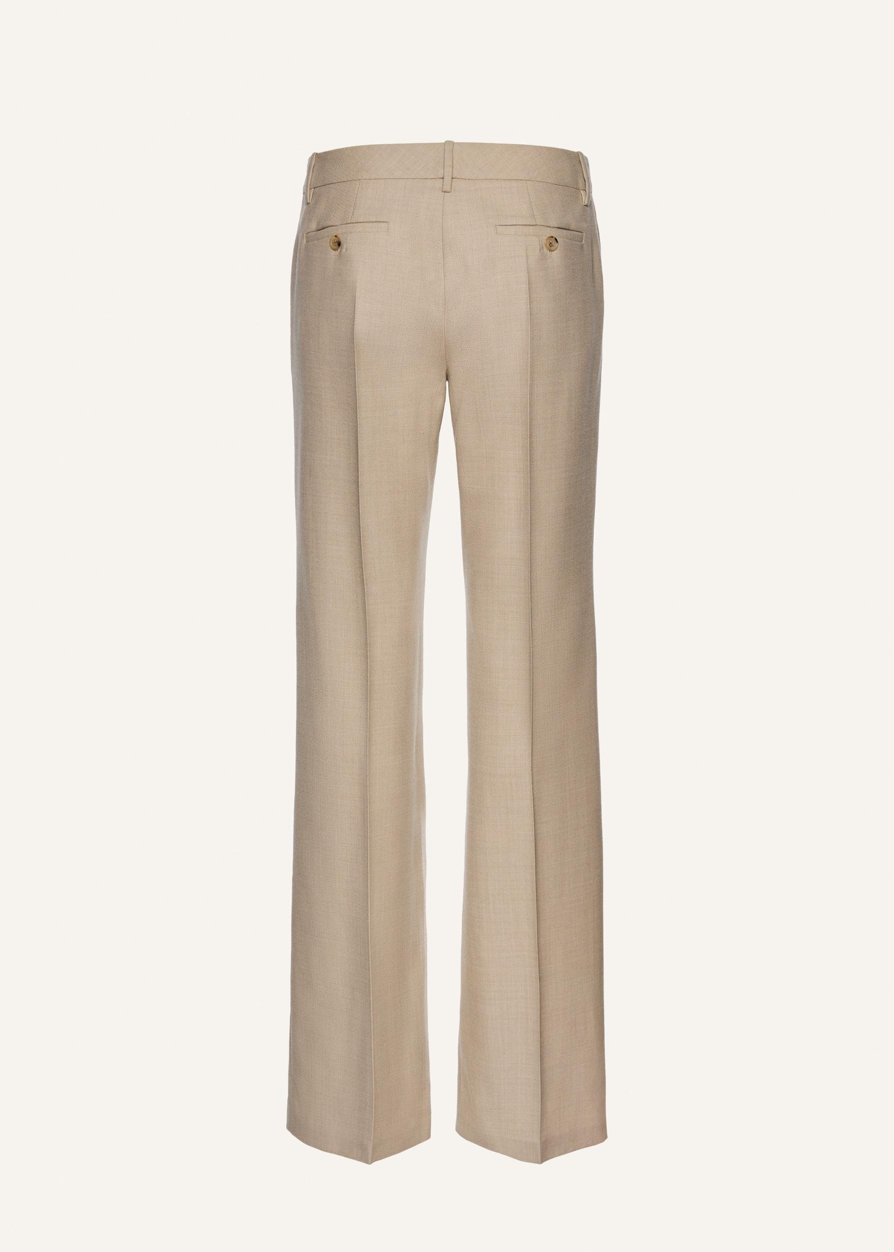 Front-pleat classic trousers in beige Product Image