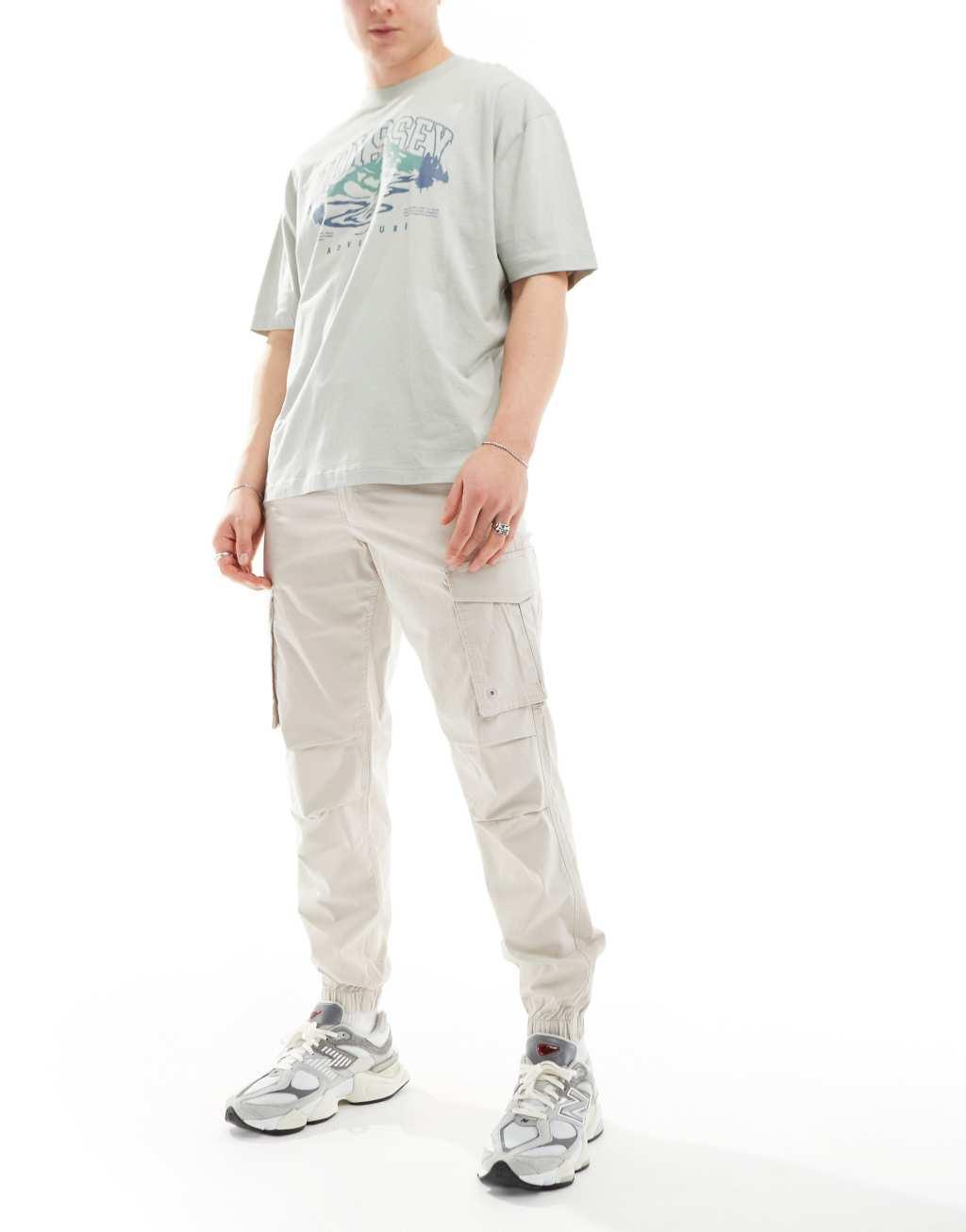 Jack & Jones relaxed fit cuffed cargo pants in beige  Product Image