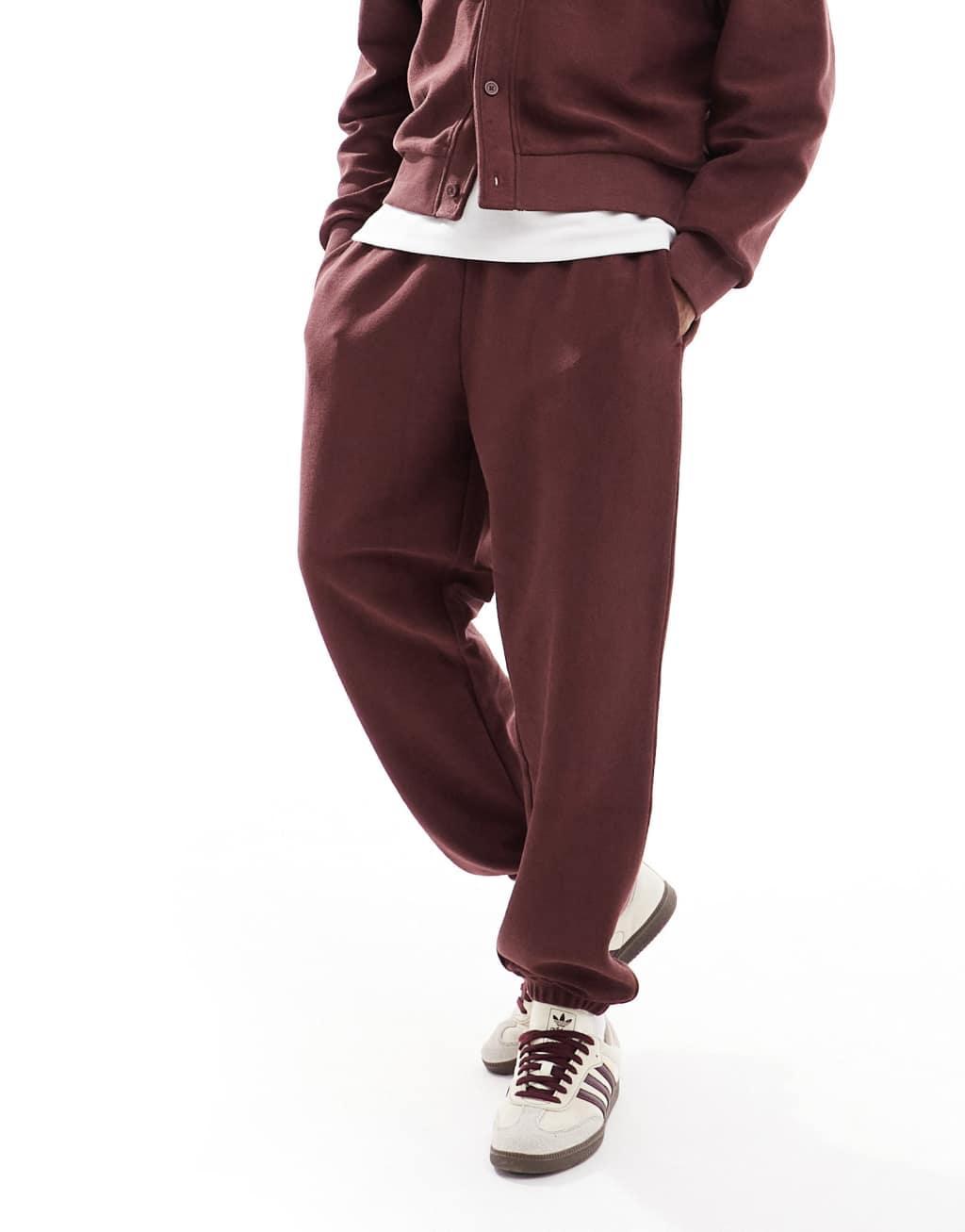 ASOS DESIGN oversized textured sweatpants in burgundy - part of a set Product Image