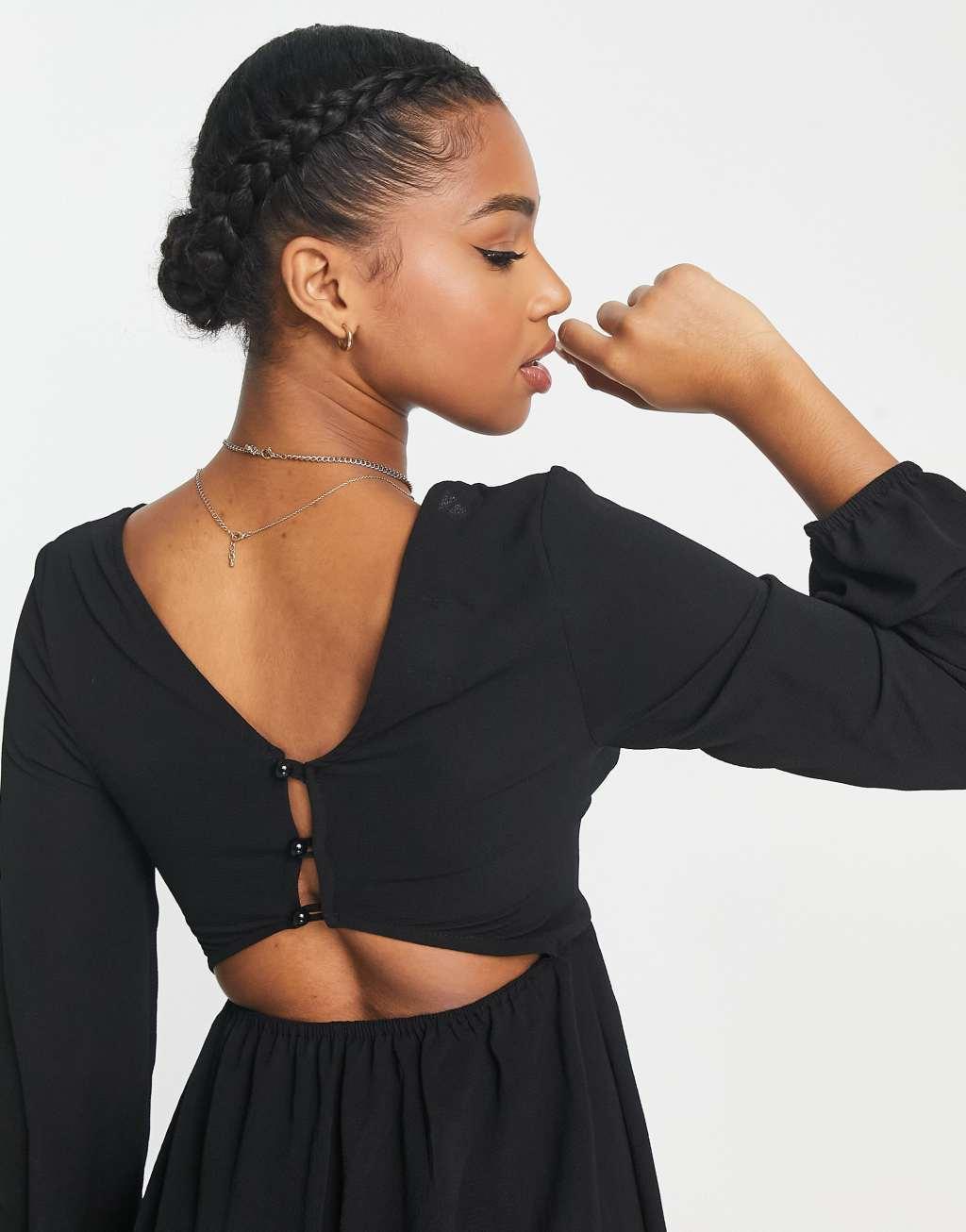 ASOS DESIGN bubble crepe button back long sleeve jumpsuit in black Product Image