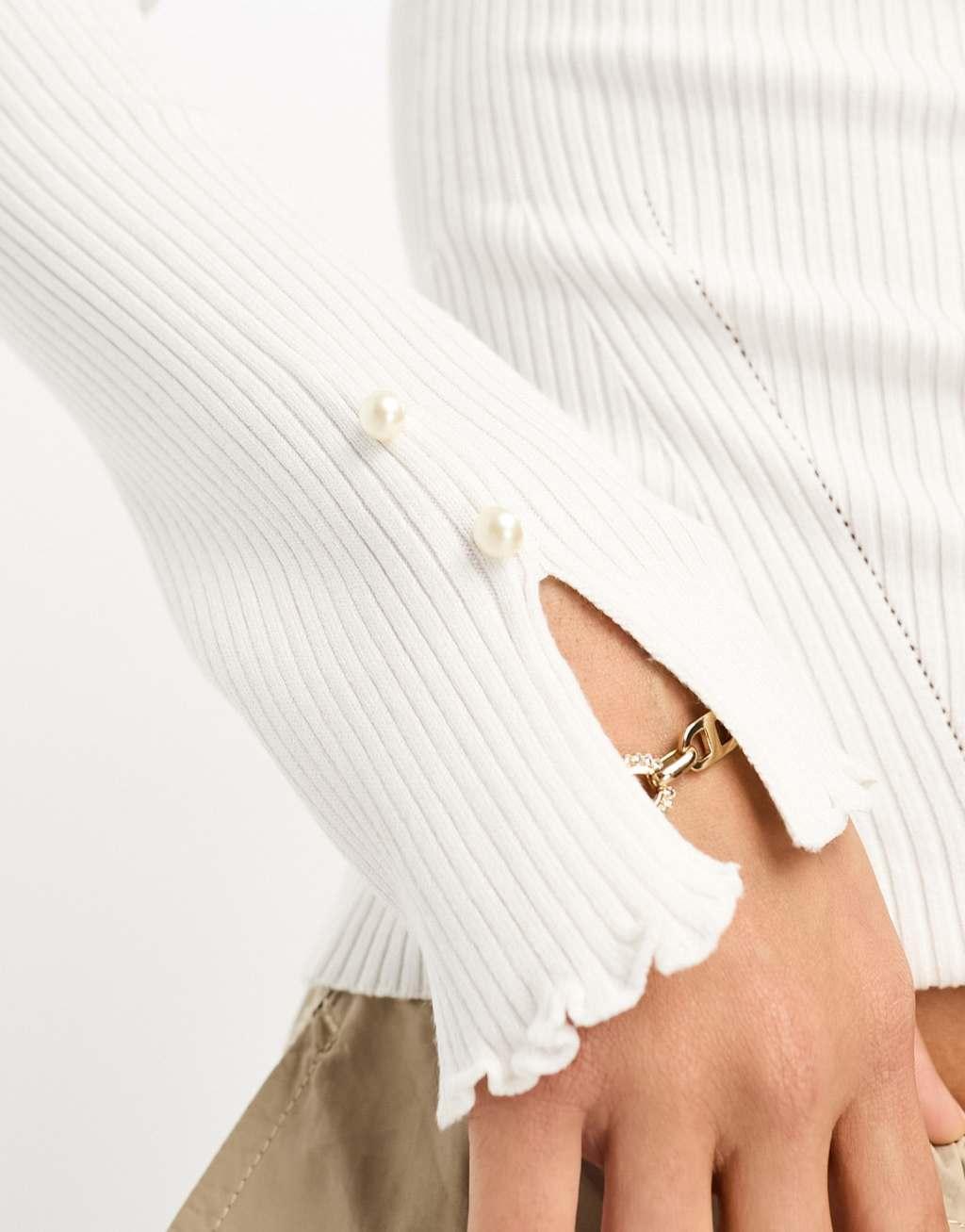 River Island ribbed top with frilled sleeve in white Product Image