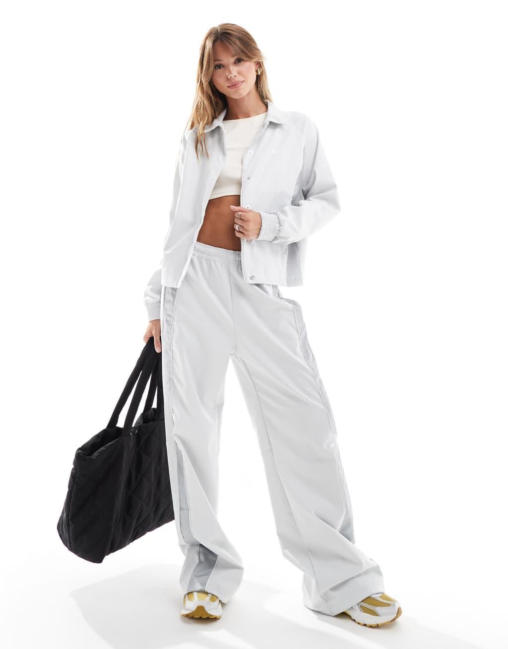 Nike panelled woven pants in gray Product Image