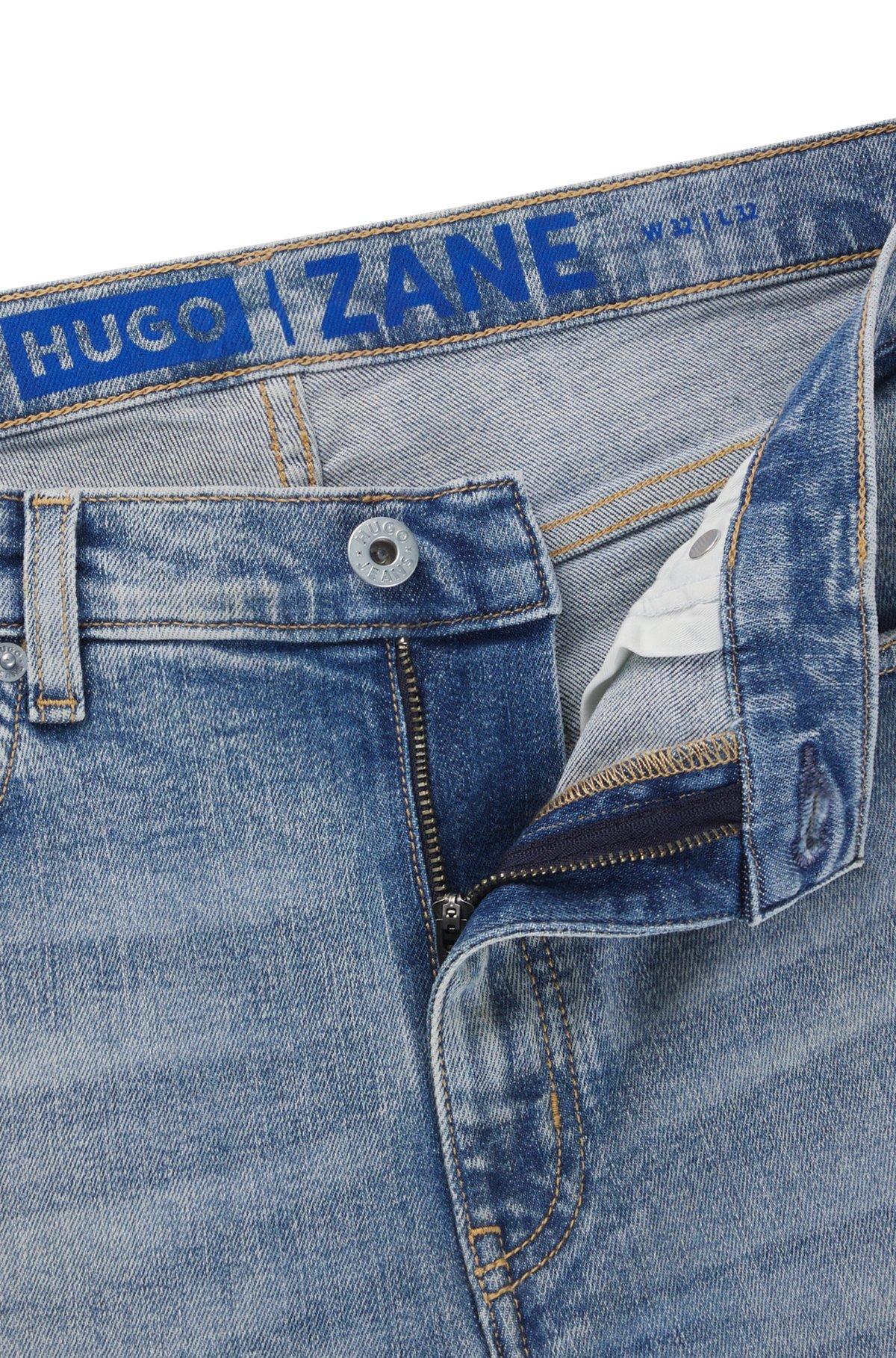 Extra-slim-fit jeans in stonewashed blue stretch denim Product Image